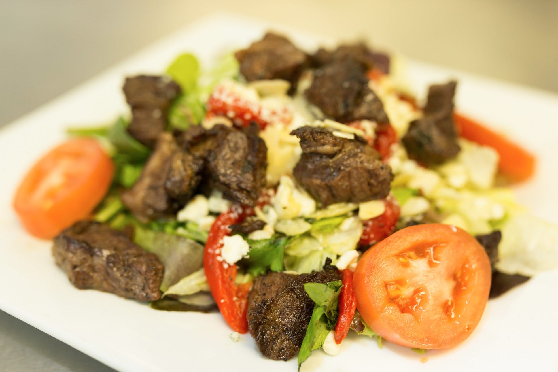 Order Bistro Steak Salad - Salad food online from Carmelo's Pizza, Pasta, Subs & More!! store, Linthicum Heights on bringmethat.com