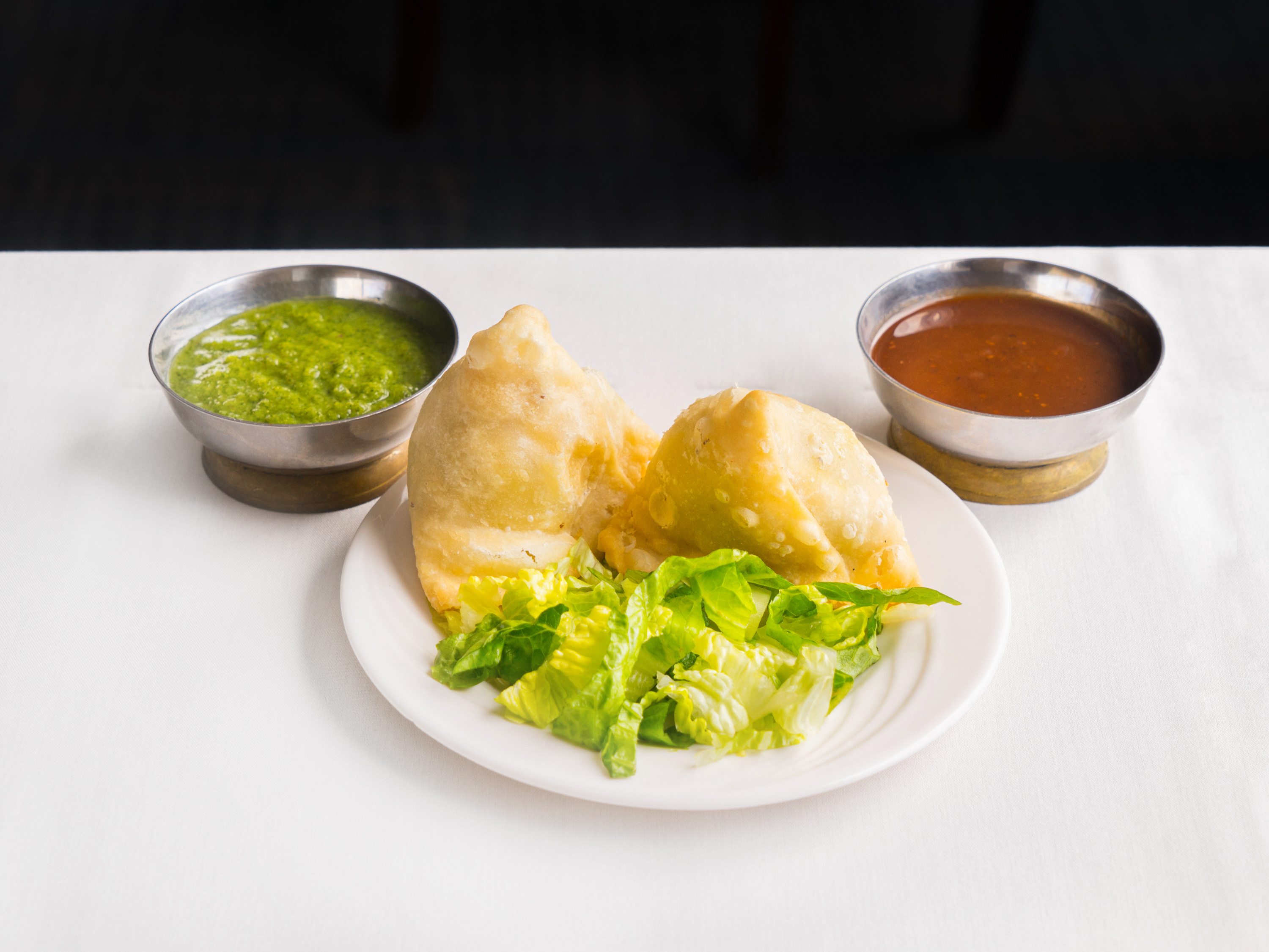 Order Vegetable Samosa food online from India Palace store, Burnsville on bringmethat.com