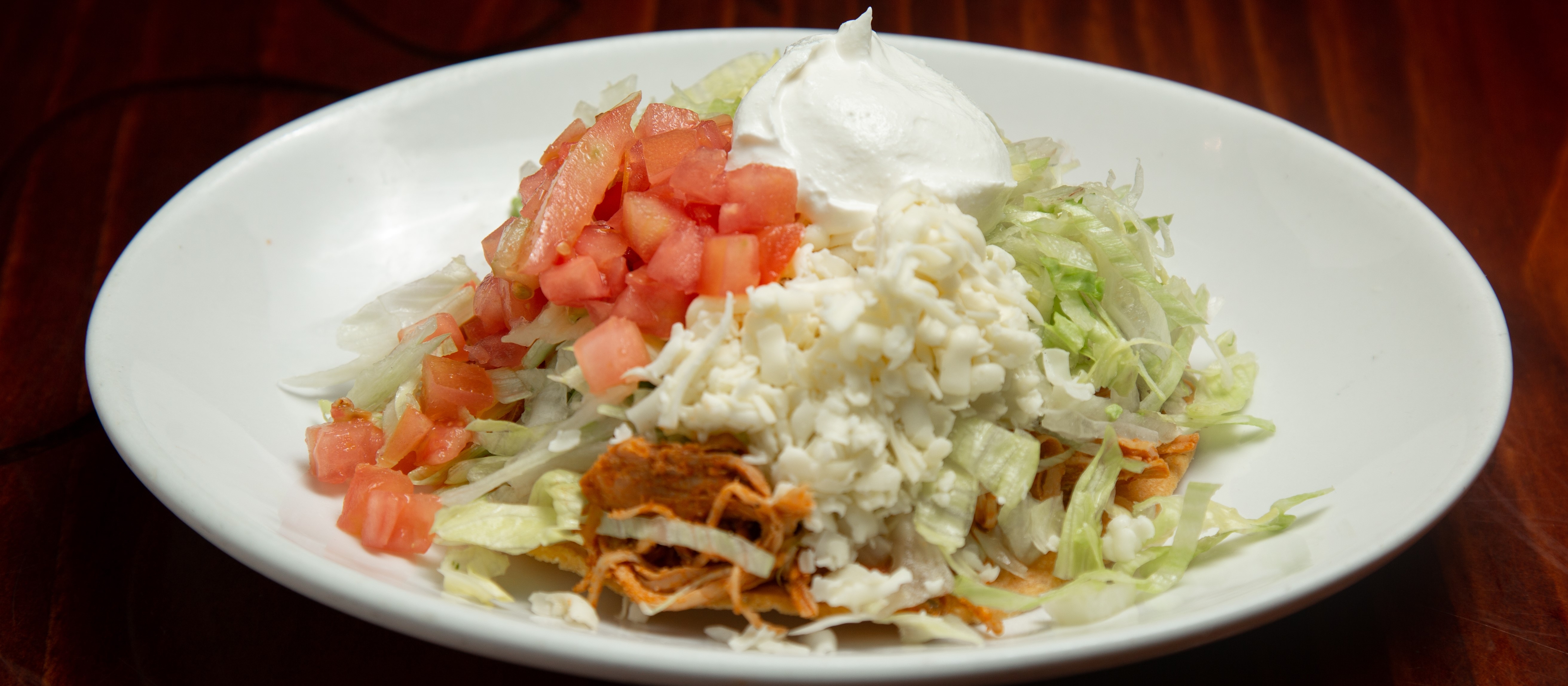 Order Chicken Tostada food online from Tito Mexican Restaurant store, Spring Hill on bringmethat.com