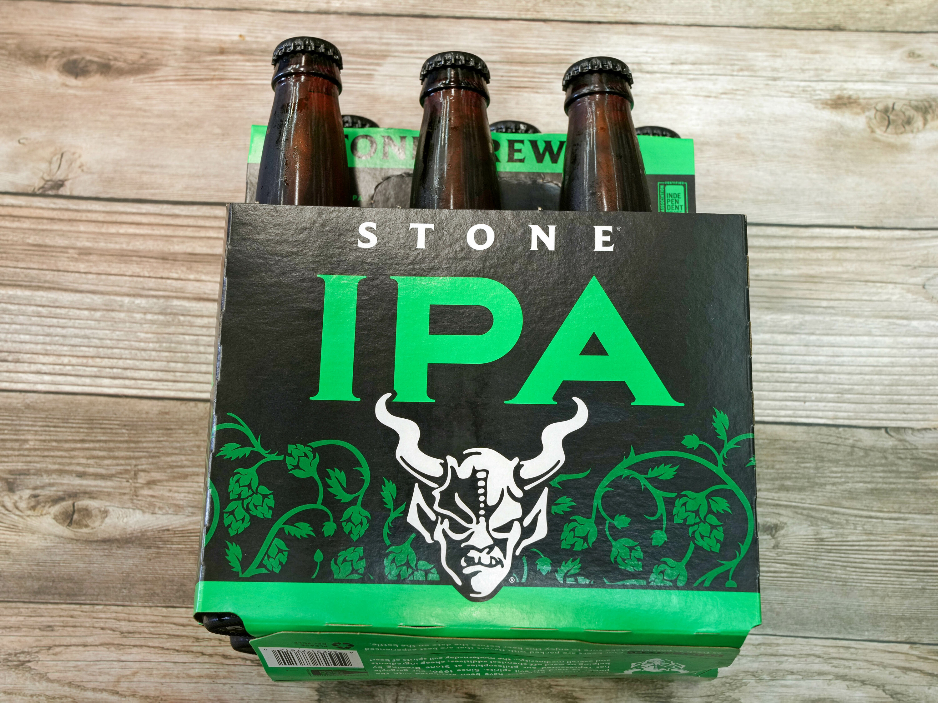 Order Stone IPA, 6 Pack can food online from Holiday Liquor Market store, Los Angeles on bringmethat.com