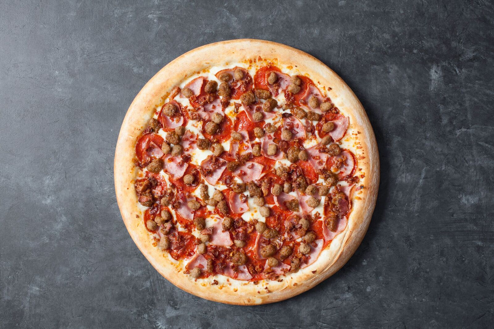 Order Meat Lover's Pizza- LARGE 14" (8 slices) food online from Pizza Fuego store, San Bernardino on bringmethat.com