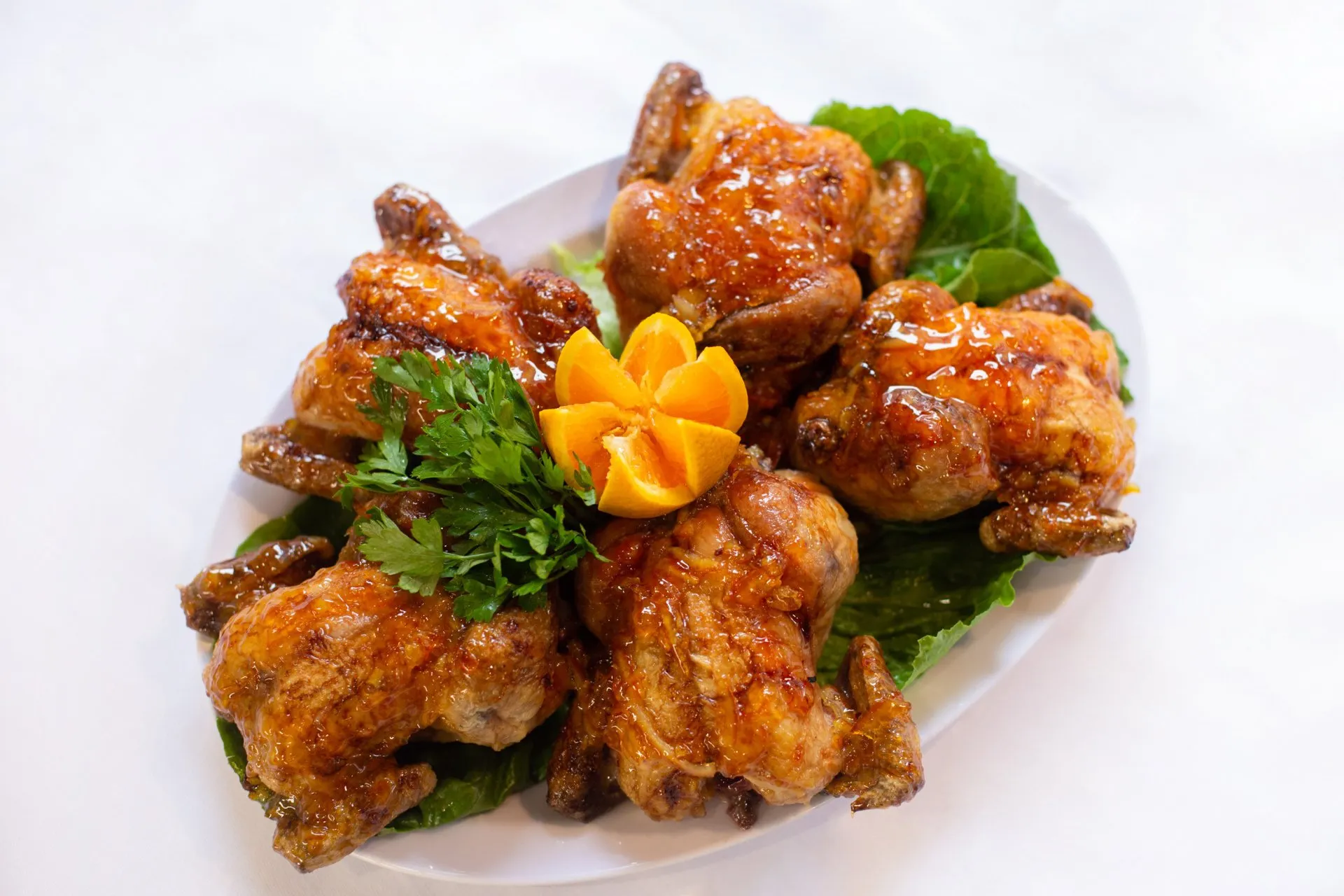 Order Orange Glazed Cornish Hen food online from Food Passion Cafe store, New York on bringmethat.com