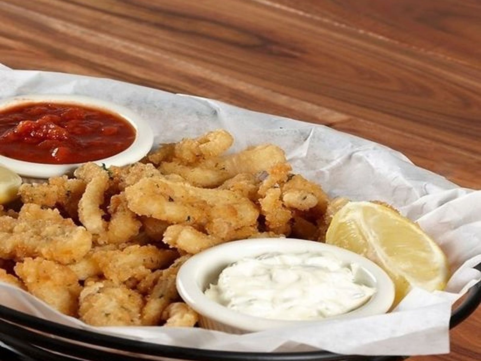 Order A9. Fried Calamari (15) food online from Juicy Seafood store, Clarksville on bringmethat.com