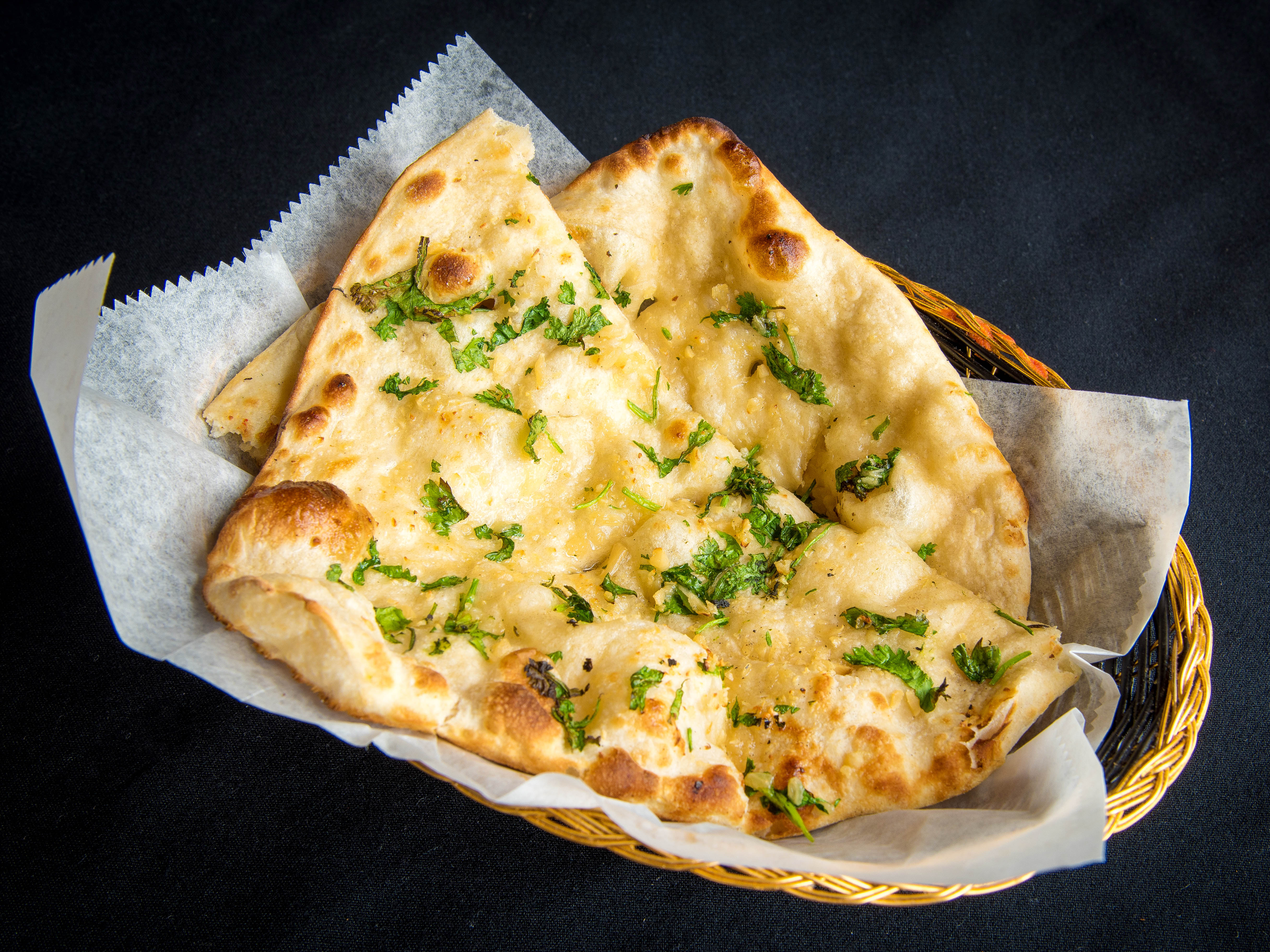 Order Garlic Naan food online from Minar Indian Cuisine store, New Hartford on bringmethat.com