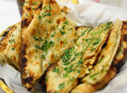 Order Garlic Cheese Naan food online from Himalayan Yak & Yeti store, San Diego on bringmethat.com
