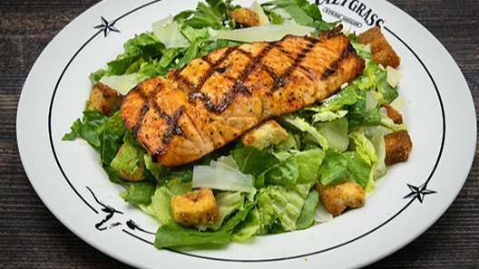 Order Salmon Caesar Salad food online from Saltgrass Steak House store, San Antonio on bringmethat.com