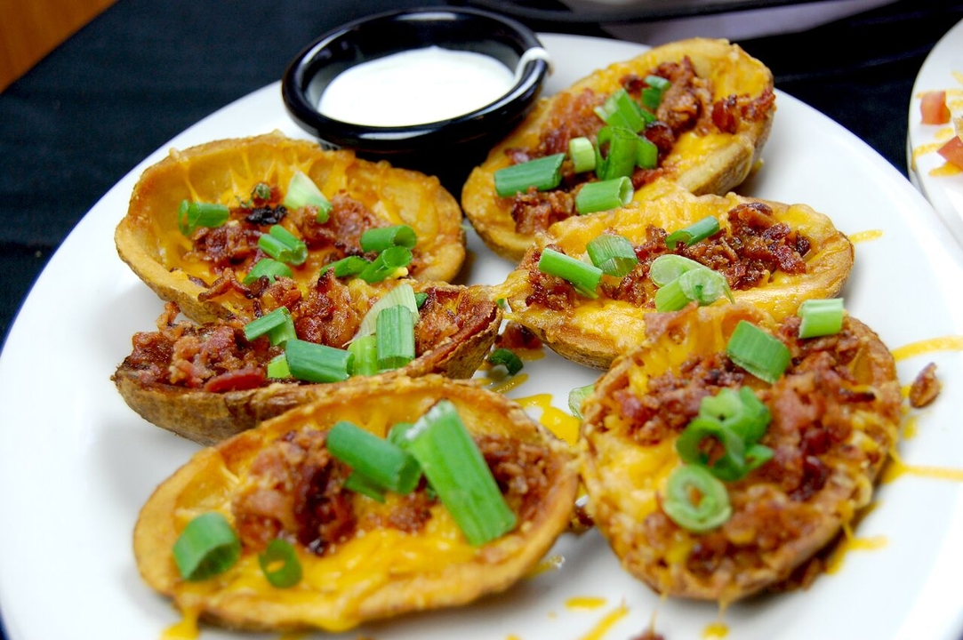 Order Loaded Potato Skins food online from Ryan Sports Grill store, Fort Collins on bringmethat.com
