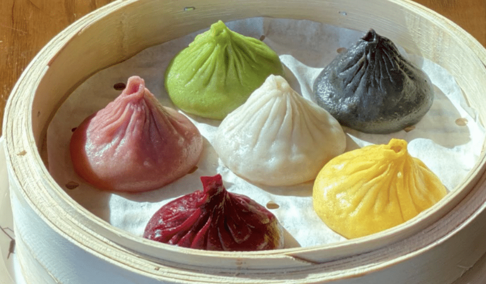 Order Pork Xiao Long Bao The OG 7 Rainbow food online from Facing East Noodle & Bar store, San Diego on bringmethat.com