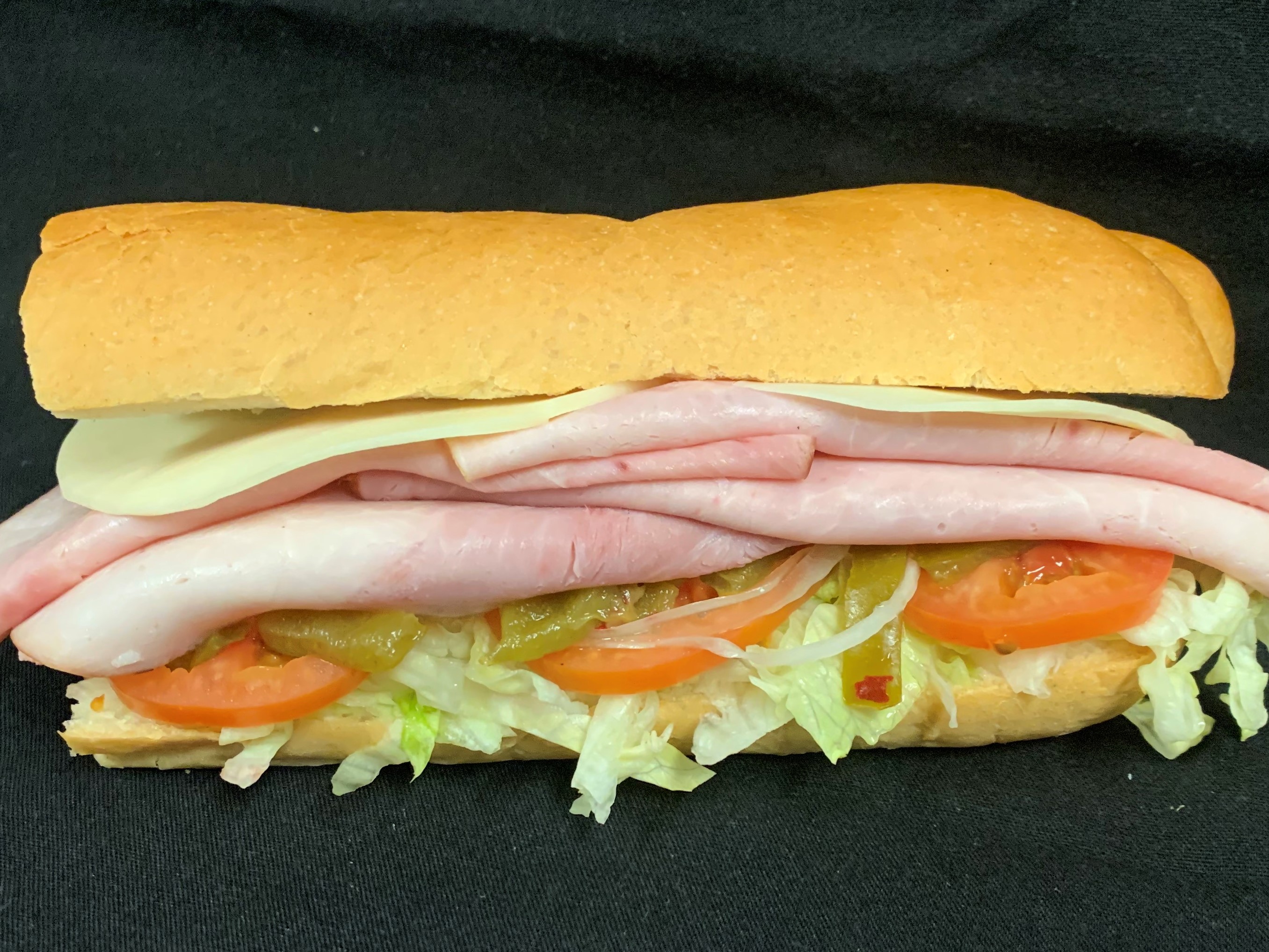 Order 14. Ham, Turkey and Cheese Sub food online from Tony Subs & Pizza store, Inglewood on bringmethat.com