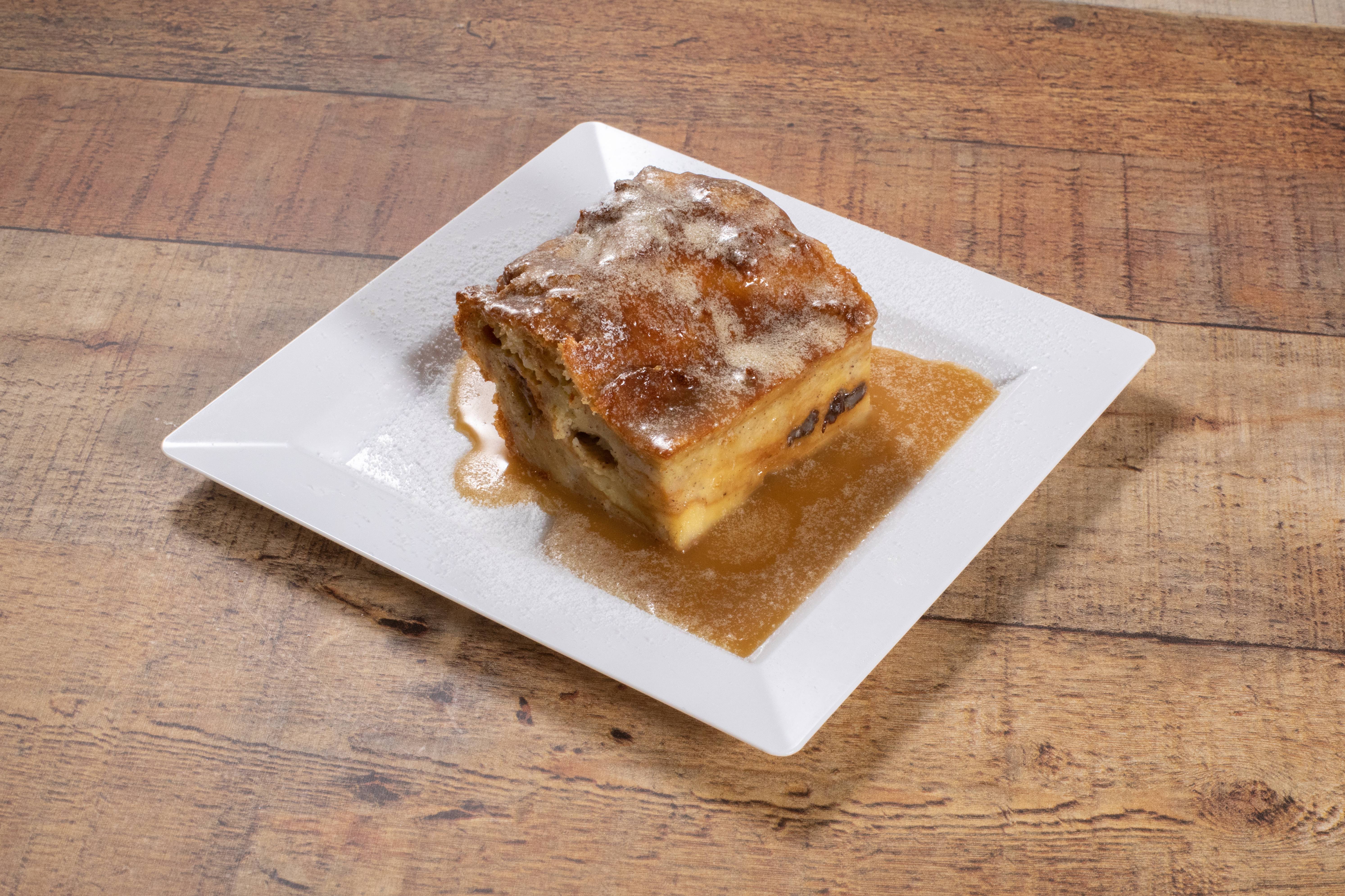 Order Mama’s Bread Pudding with Rum Sauce food online from Ragin Cajun store, Houston on bringmethat.com