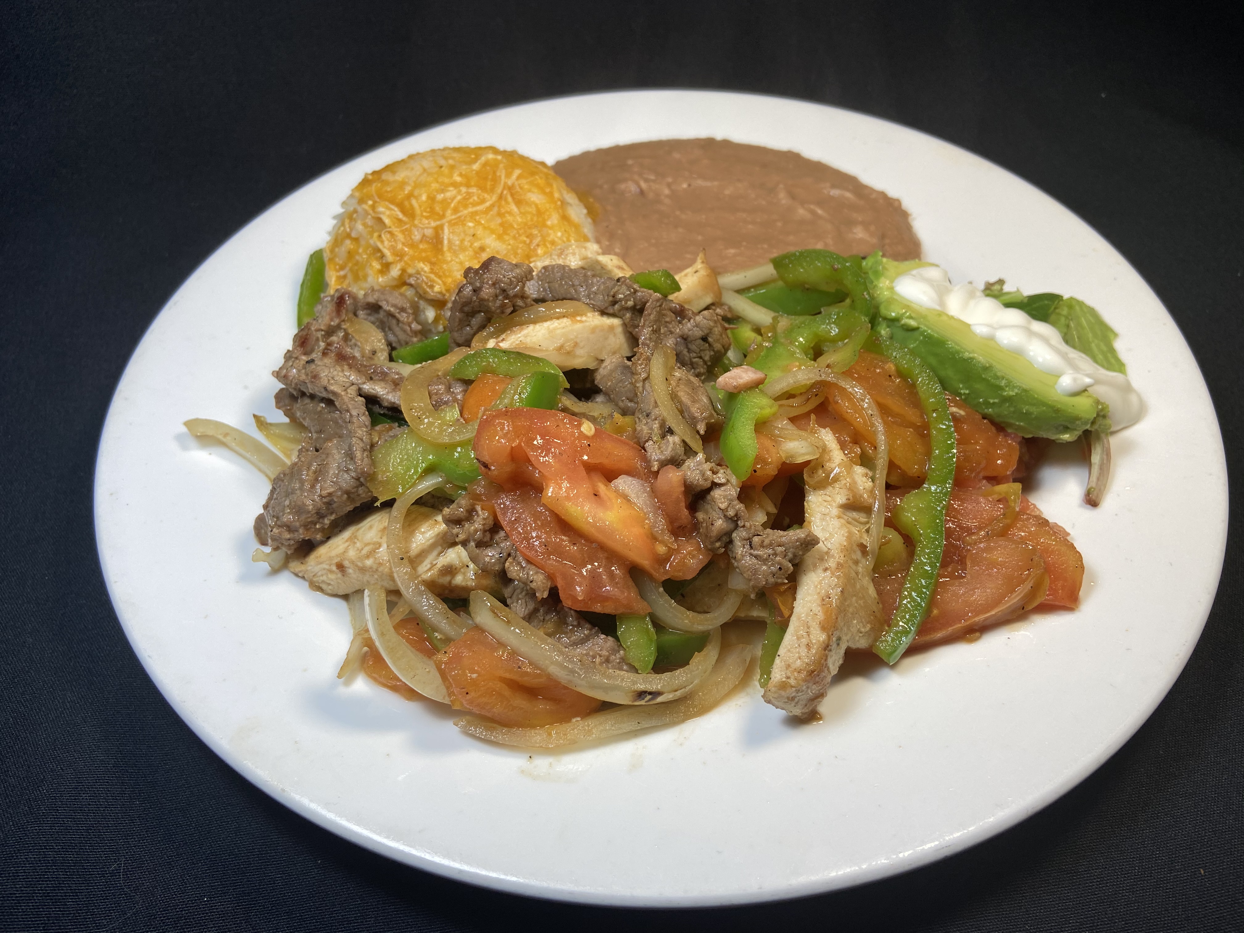 Order Mix Fajitas Plate food online from Adelita Taqueria Restaurant & Bar store, San Jose on bringmethat.com