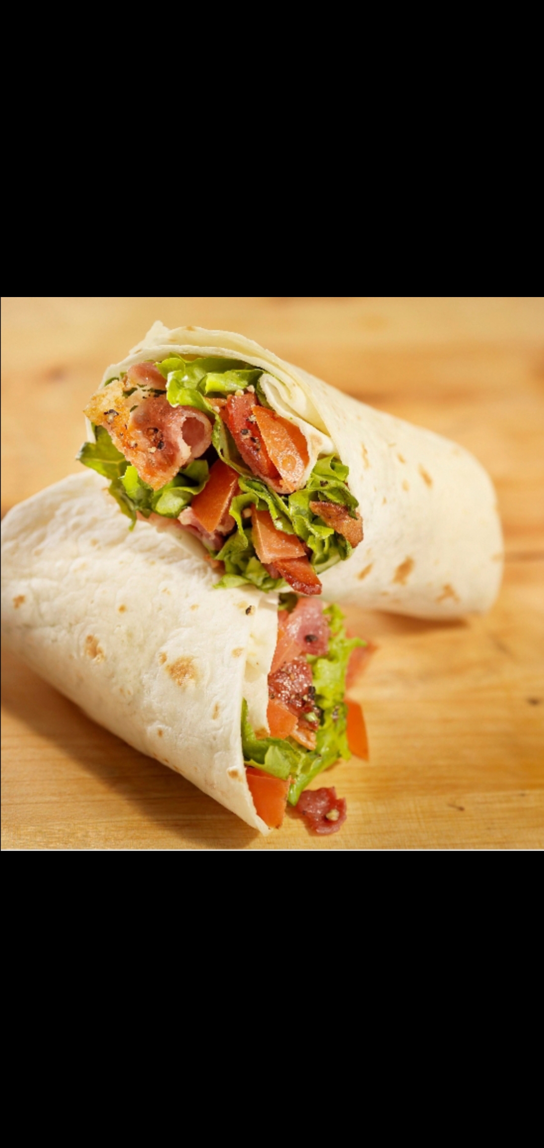 Order BLT Wrap (bacon lettuce & tomatoes wrap) food online from American Gourmet Foods Deli store, New York on bringmethat.com