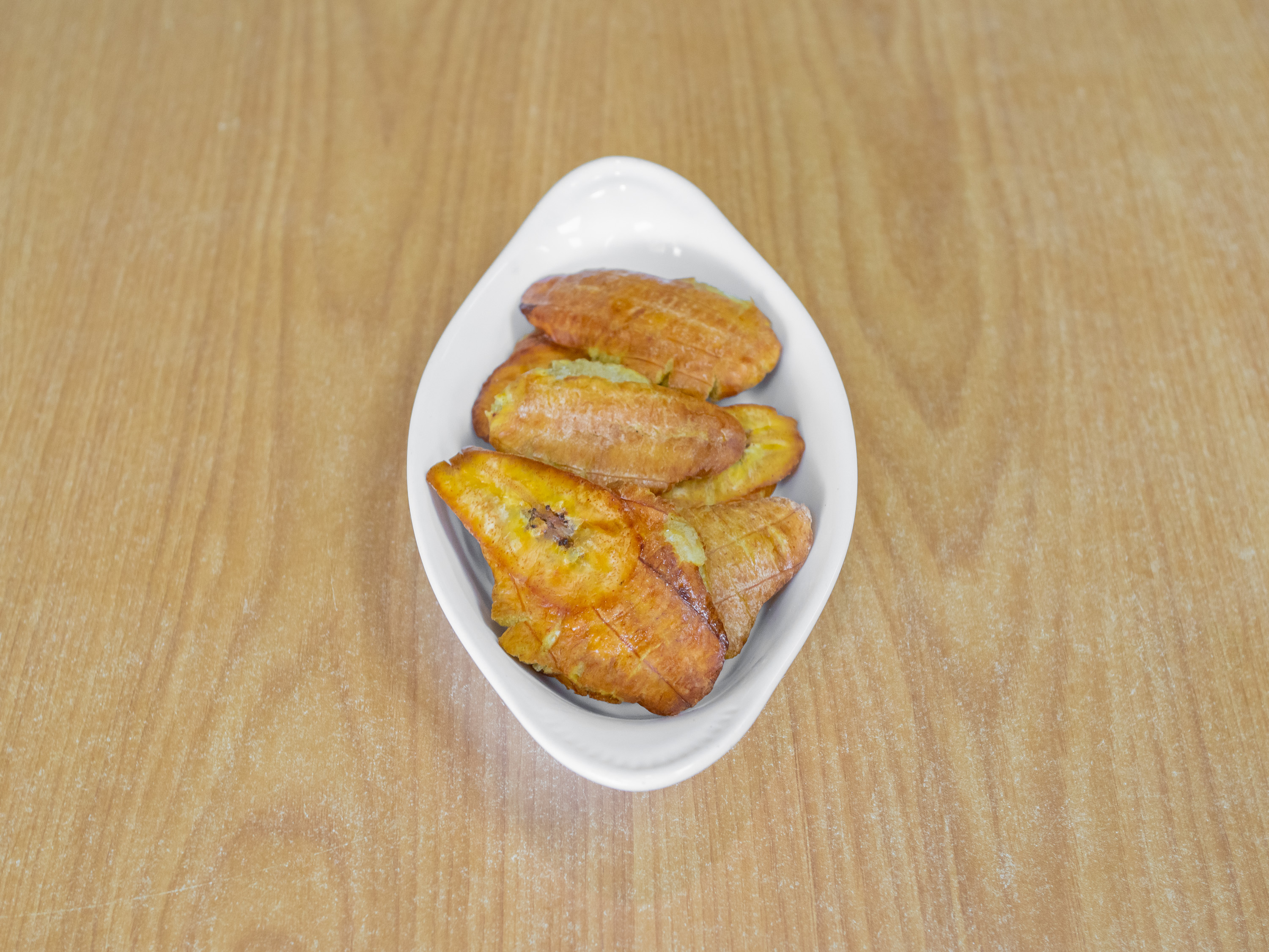 Order TOSTONES (Green Fried Plantains) food online from Fusion Cocina Latina store, Columbia on bringmethat.com