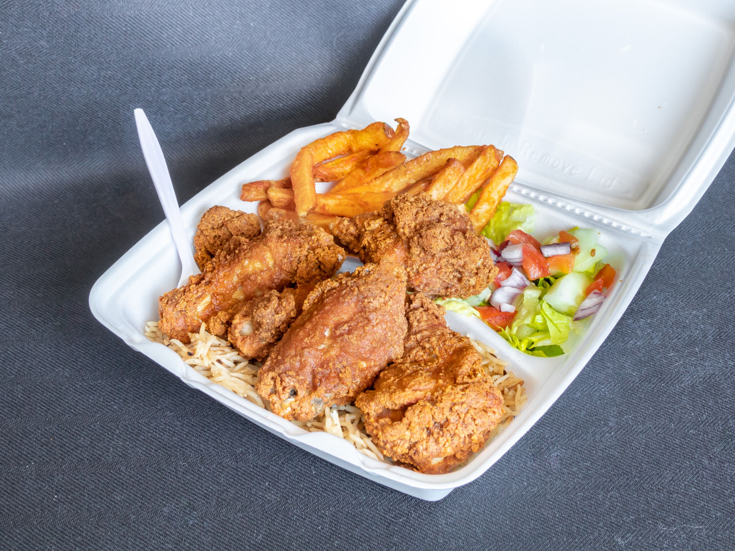 Order Hot Wings Over Rice Platter food online from Taqwa Food Mart store, Bensalem on bringmethat.com