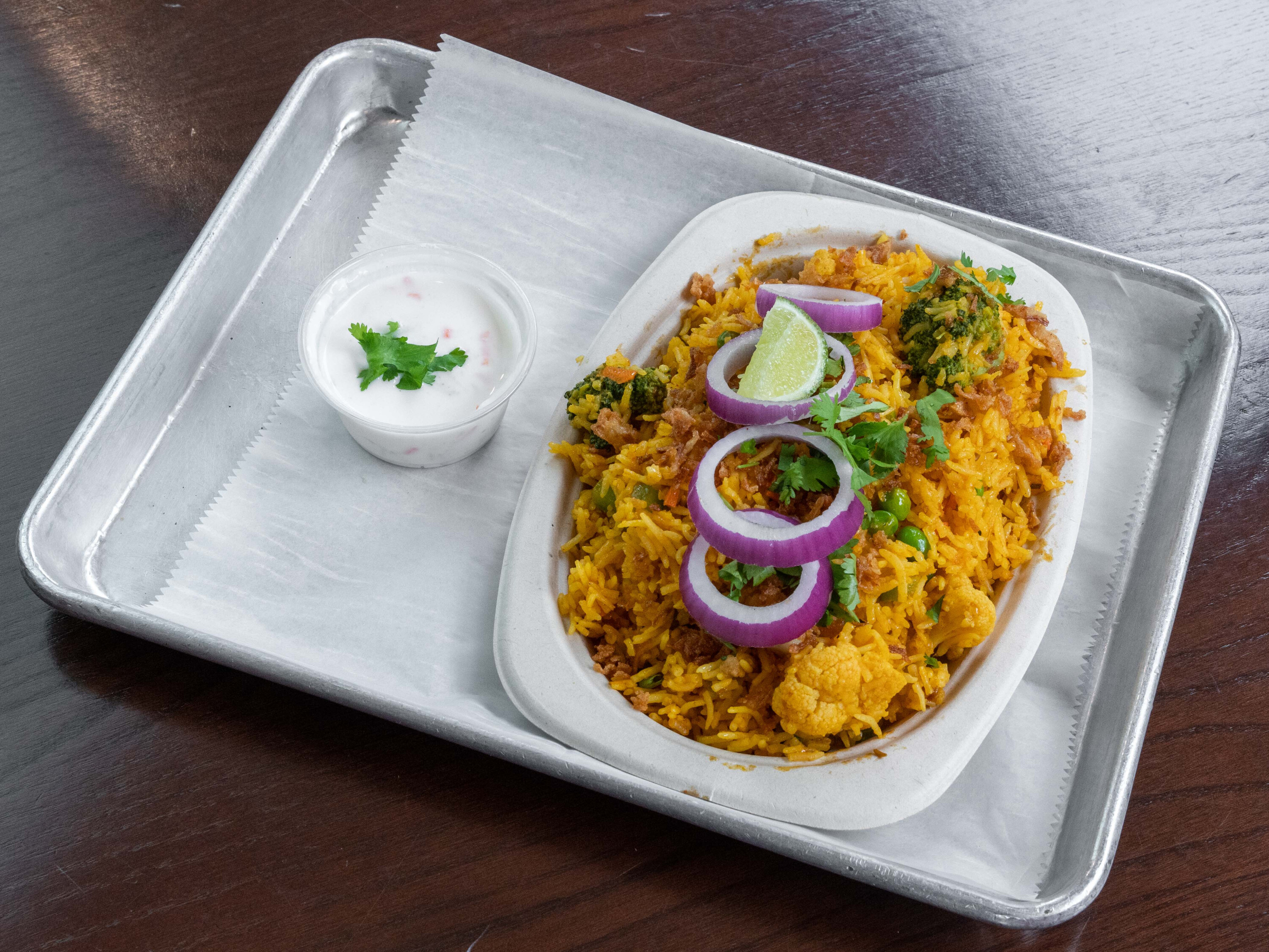 Order Veg Biryani food online from Surati Indian Street Food store, Nashville on bringmethat.com