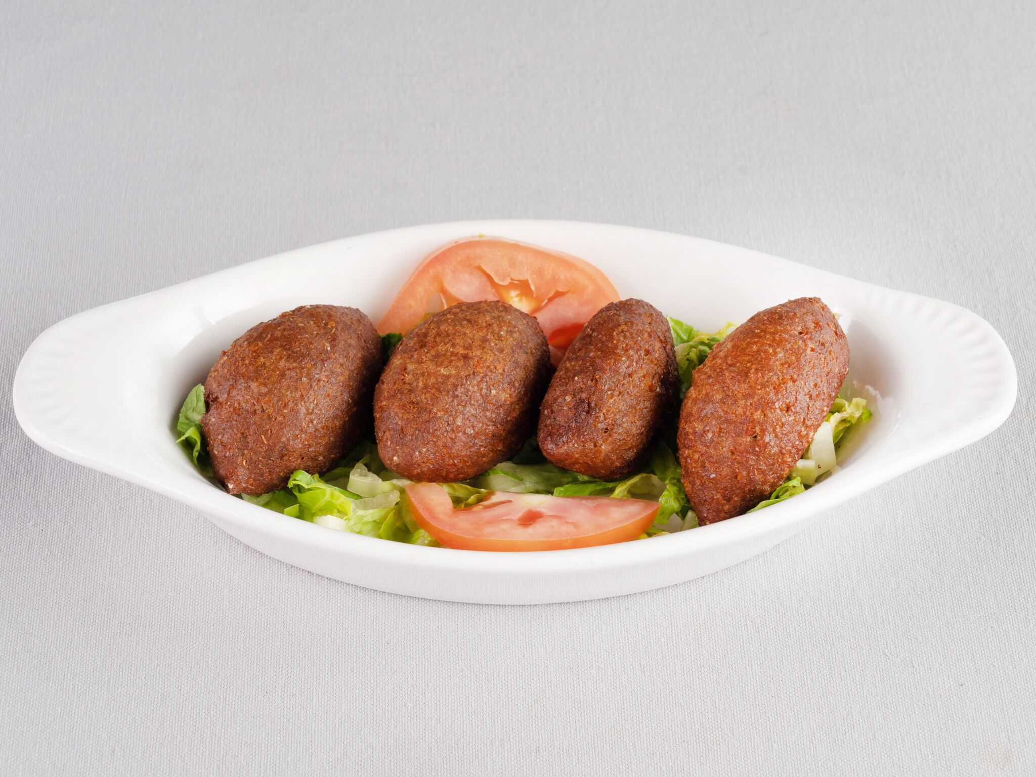 Order 4 Piece Kibbeh food online from Rest House Cafe store, Houston on bringmethat.com