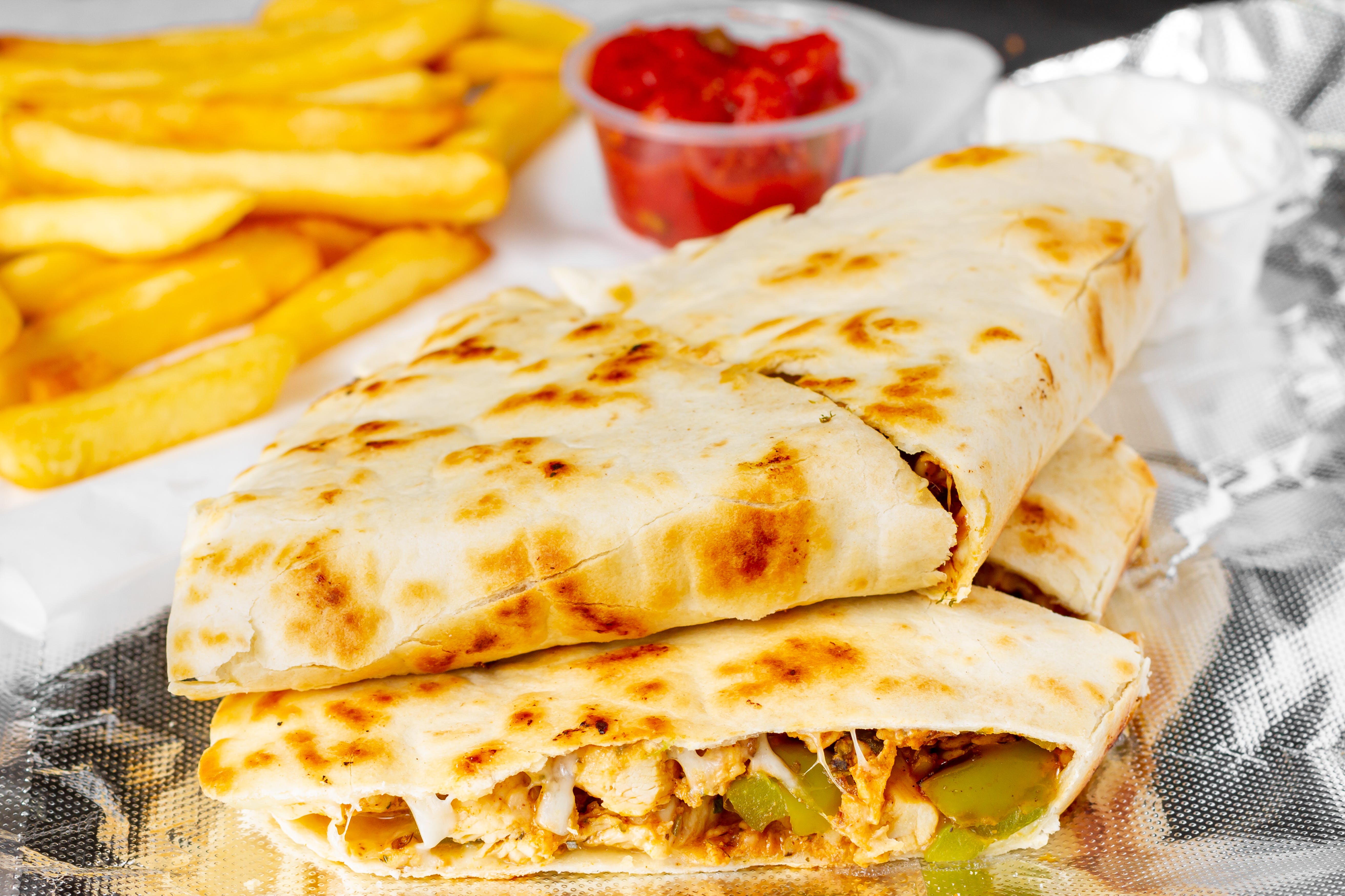 Order Grilled Chicken Quesadilla - Quesadilla food online from The Royal Pizza store, Baltimore on bringmethat.com