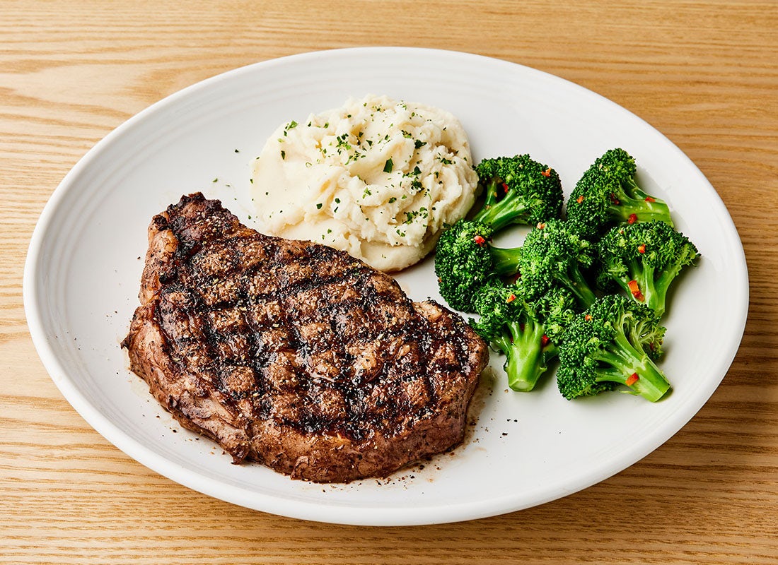 Order NEW! Tuscan-Grilled Ribeye* 16oz food online from Carrabba Italian Grill store, Fayetteville on bringmethat.com