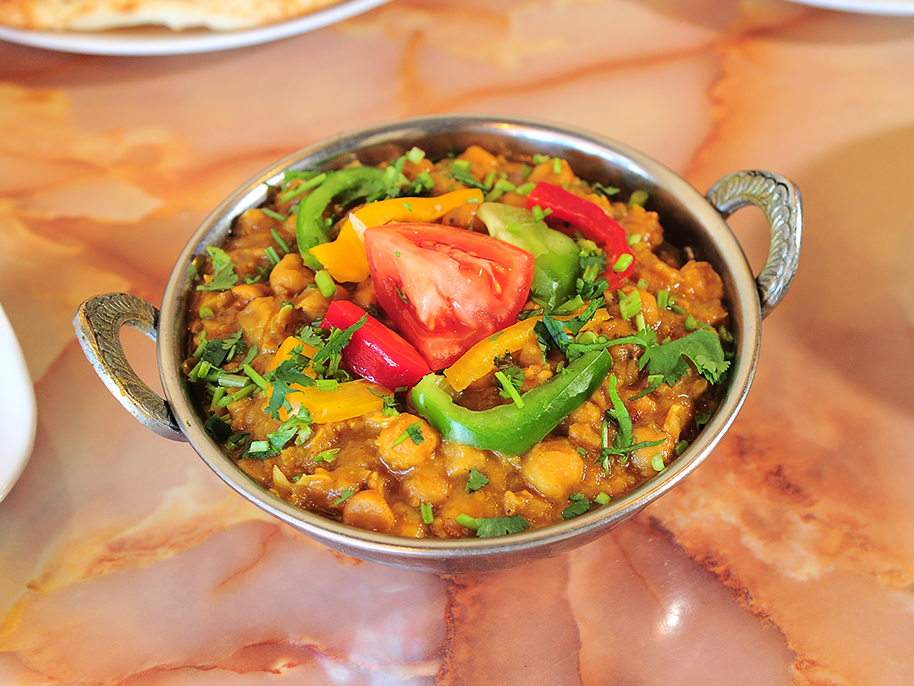 Order 119. Chana Masala food online from Haveli Indian Cuisine store, Rochester on bringmethat.com