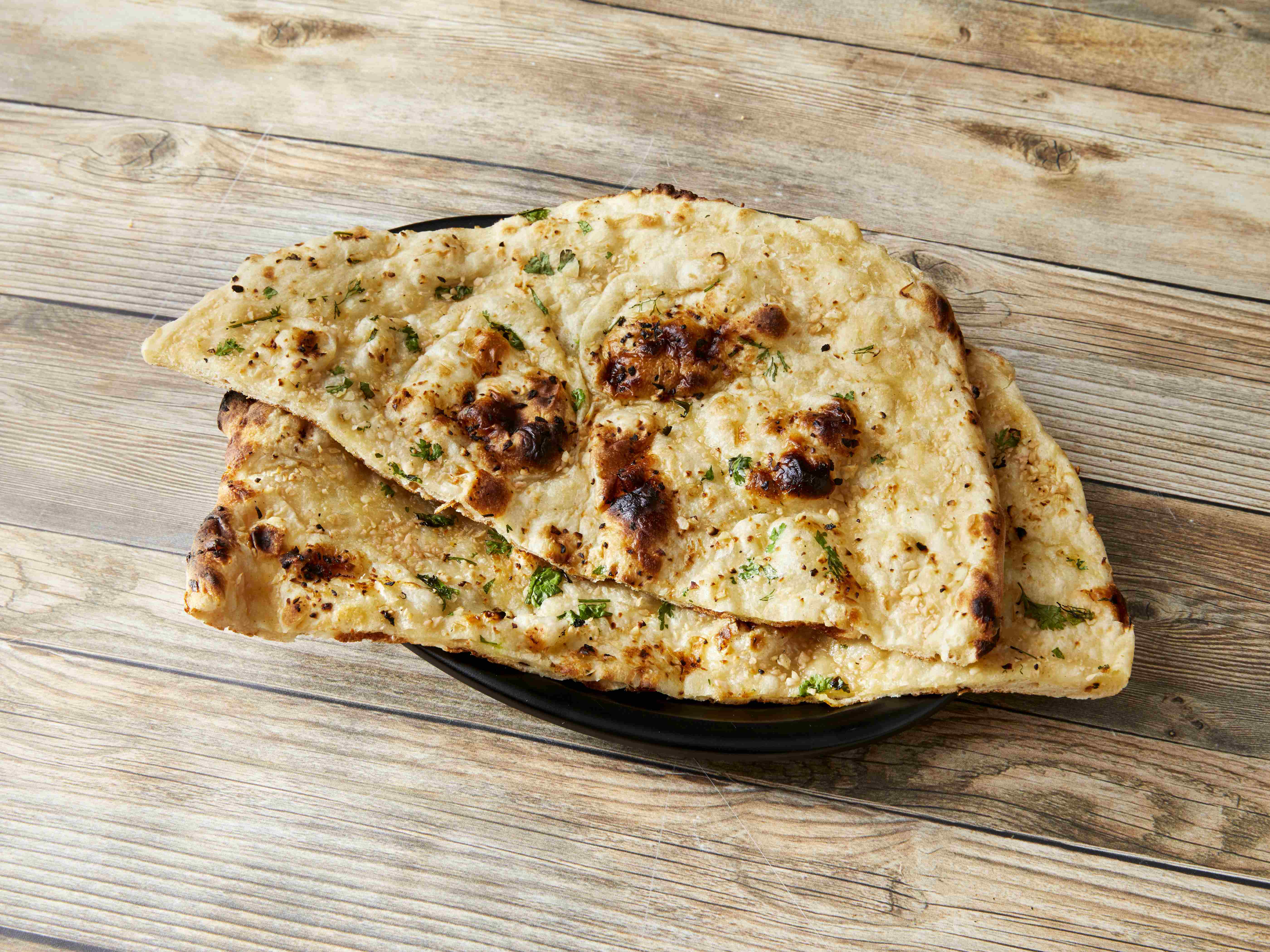Order Garlic Naan food online from Curry Kitchen Muskegon store, Muskegon on bringmethat.com