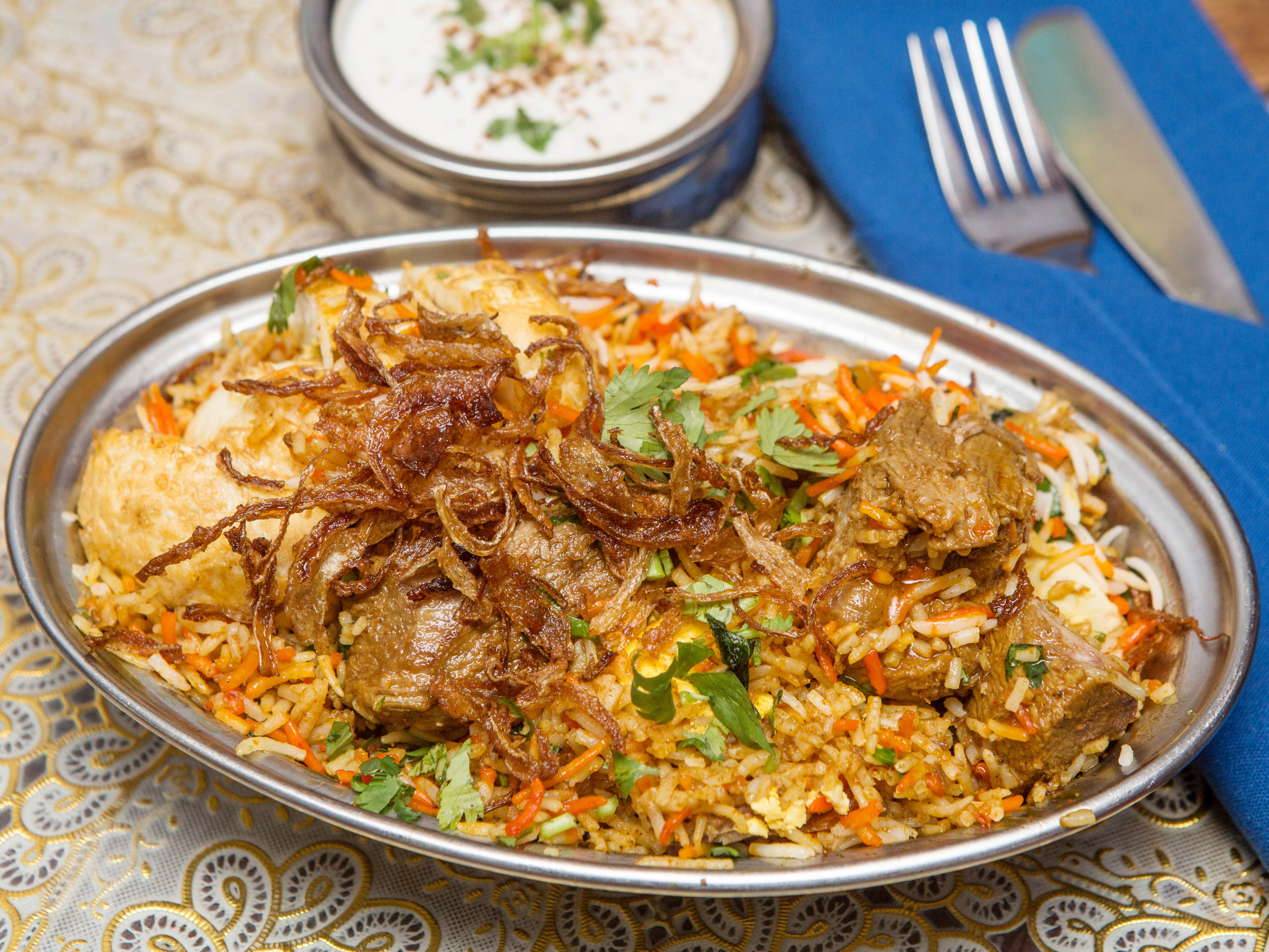 Order Goat Biryani food online from Mughlai Indian Cuisine store, New York on bringmethat.com