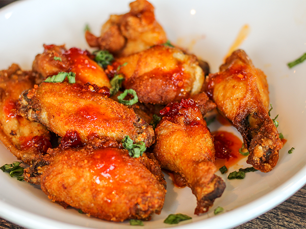 Order Crispy Confit Chicken Wings food online from Reds At Thousand Oaks store, Grand Rapids on bringmethat.com
