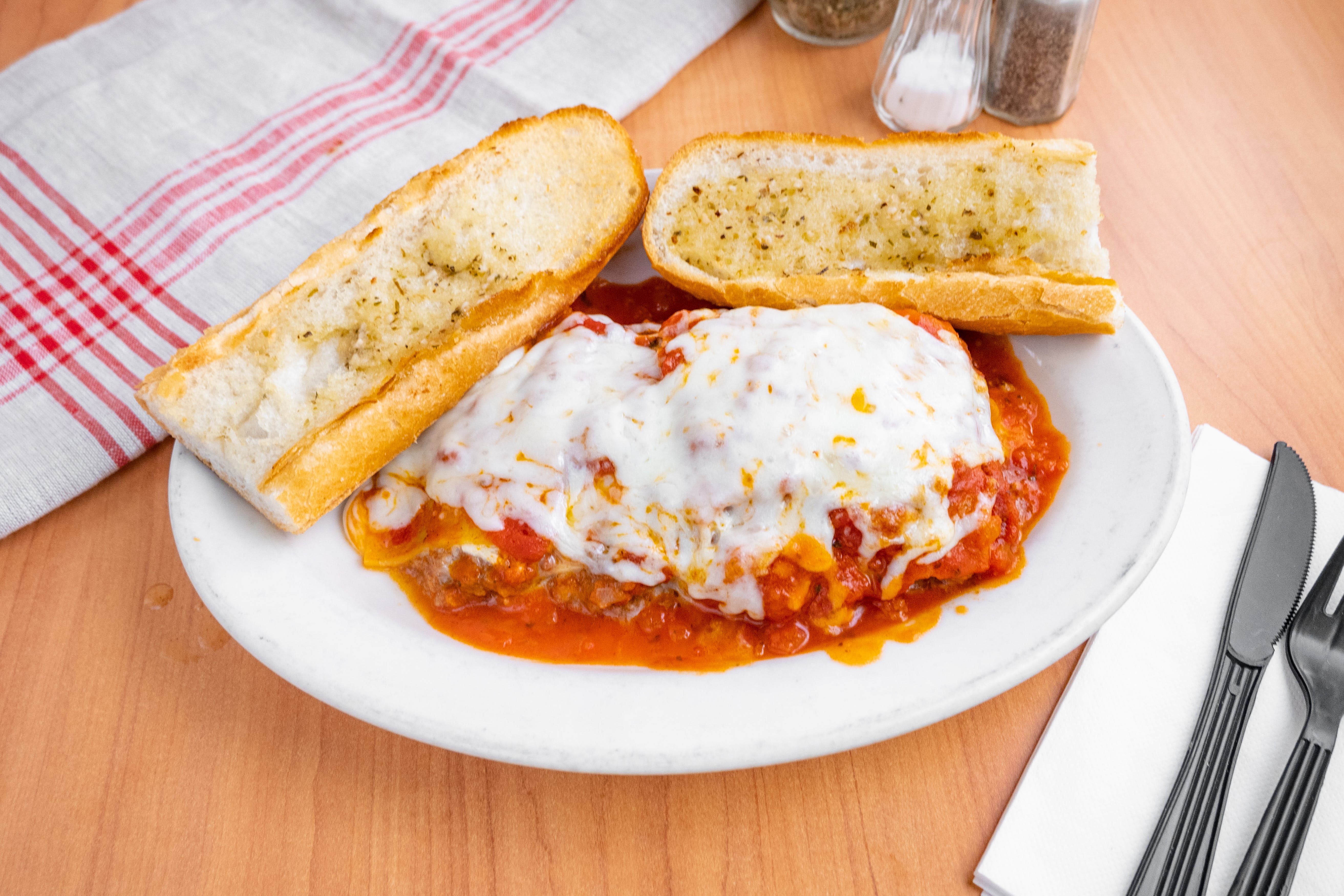 Order Homemade Meat Lasagna - Pasta food online from Bella Roma Pizza Kitchen store, Springfield on bringmethat.com