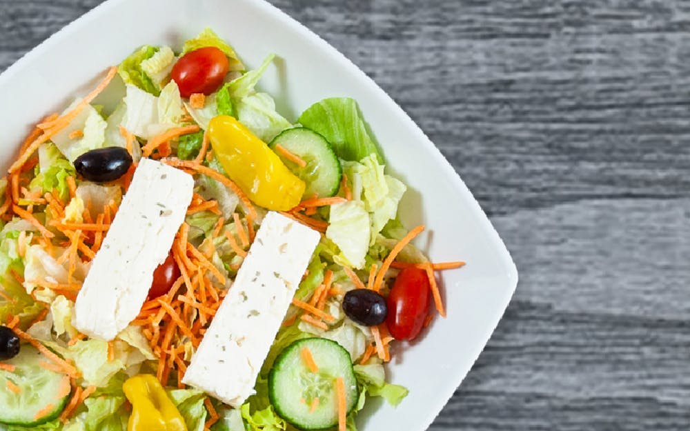 Order Greek Salad - Salad food online from Seasons Pizza store, Wilmington on bringmethat.com