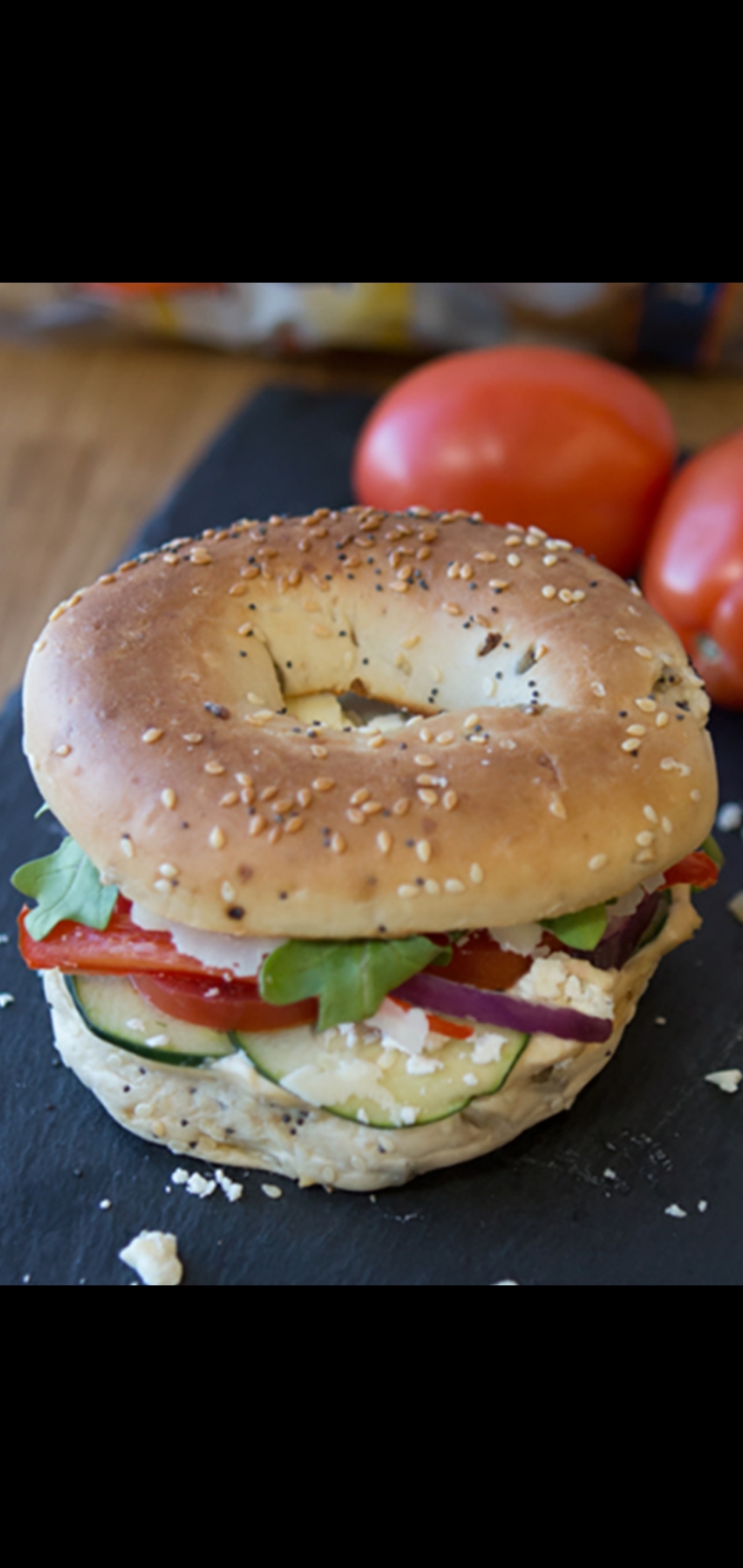 Order  Mediterranean Bagel Special (feta cheese tomatoes red onions bell peppers spring mix & cucumbers) food online from American Gourmet Foods Deli store, New York on bringmethat.com