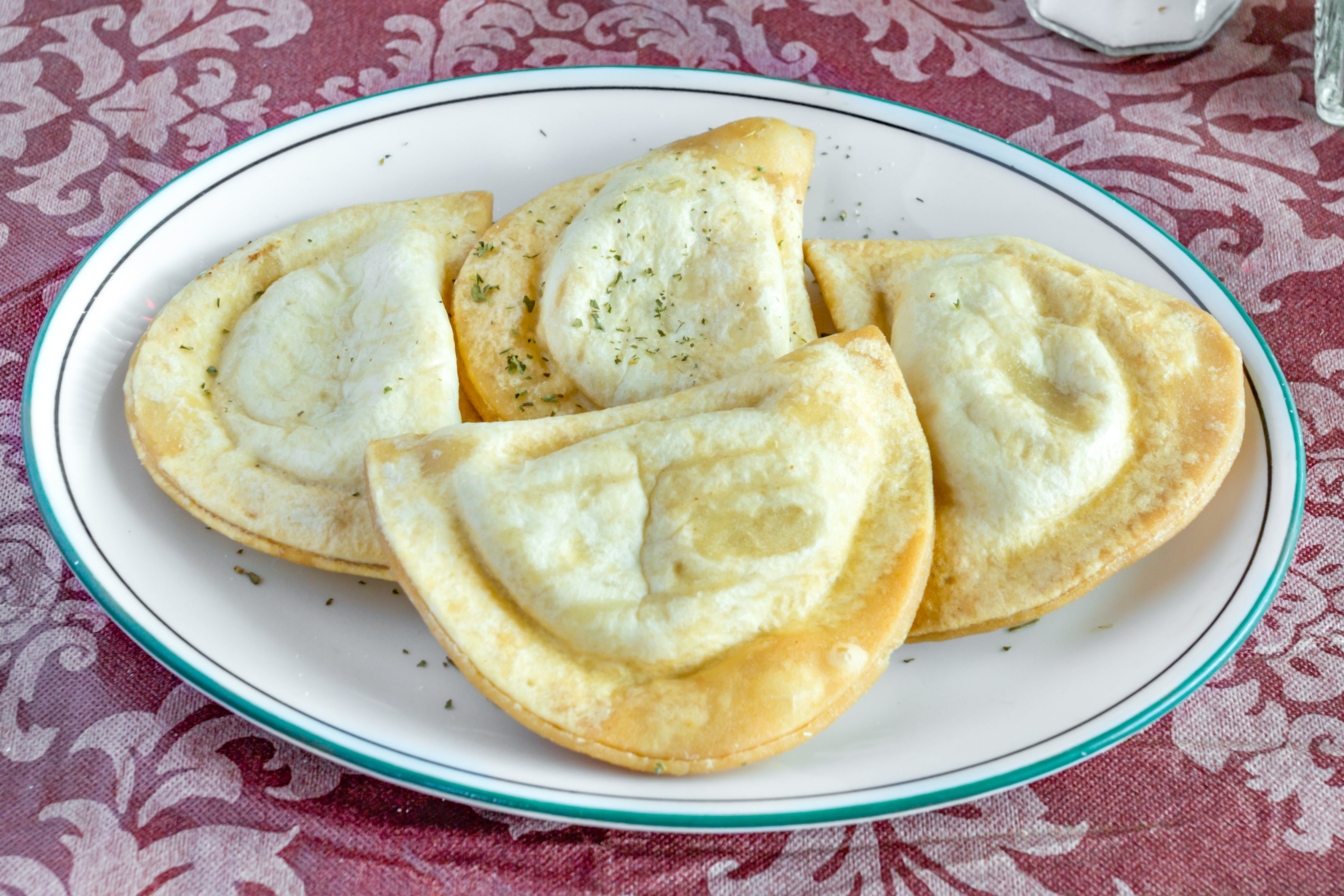 Order Pierogies - 4 Pieces food online from Fratelli Pizzeria & Cafe store, Bethlehem on bringmethat.com