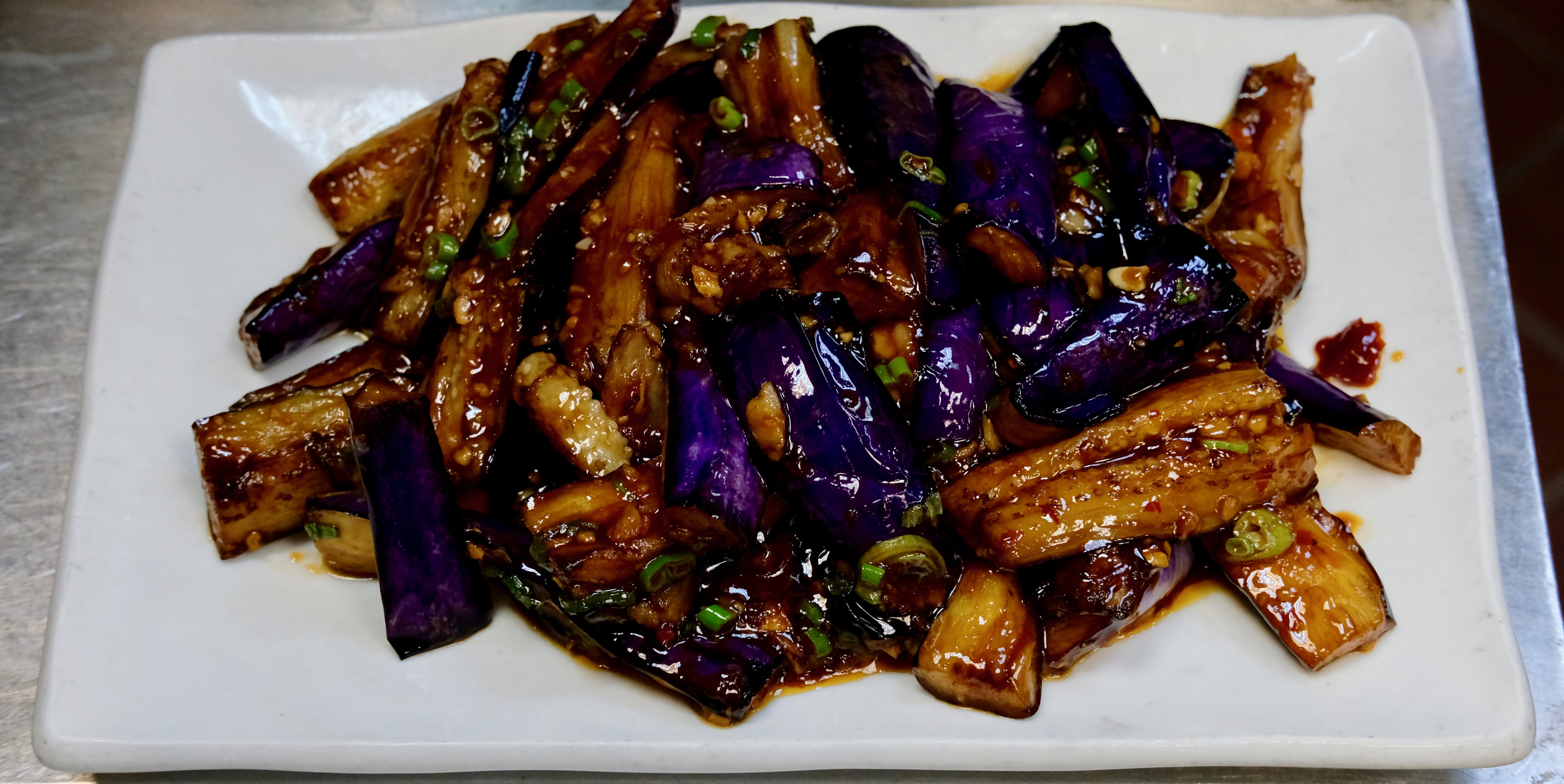 Order 99. Eggplant with Spicy Garlic Sauce food online from Ollie's Sichuan store, New York on bringmethat.com