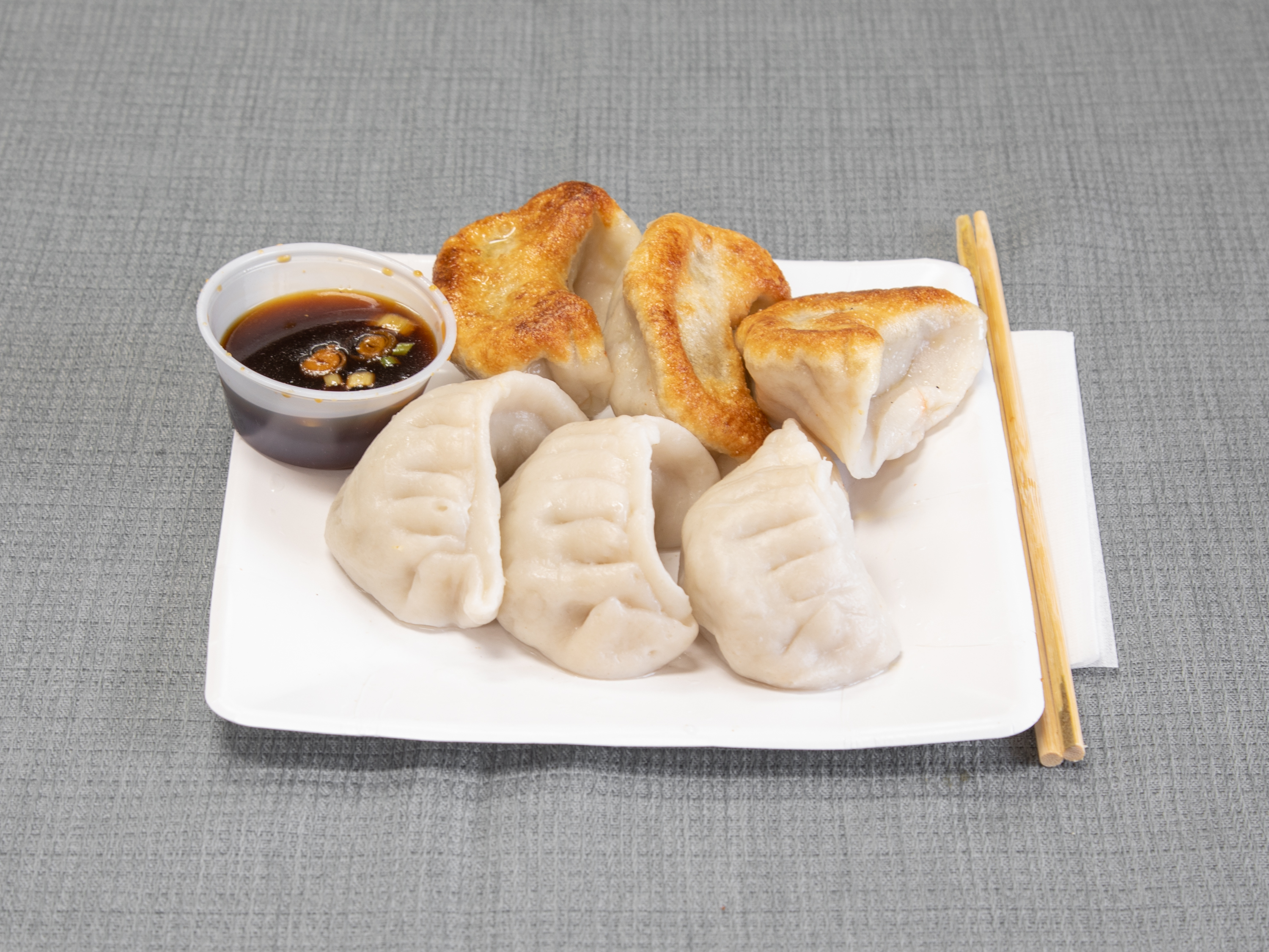 Order 7. Pork Dumplings food online from Fortune Chinese Restaurant store, Floral Park on bringmethat.com