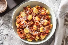 Order Gnocchi Bolognese food online from Salamones Italian Pizzeria And Restaurant store, Cherry Valley on bringmethat.com
