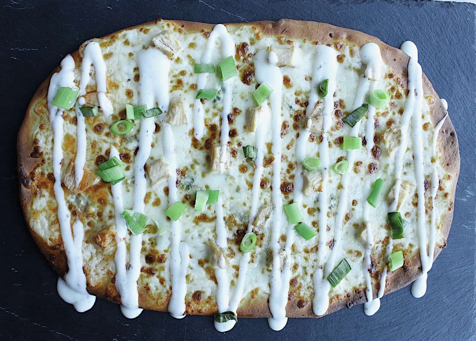 Order Buffalo Chicken Flatbread food online from Karmic Grounds store, Frisco on bringmethat.com