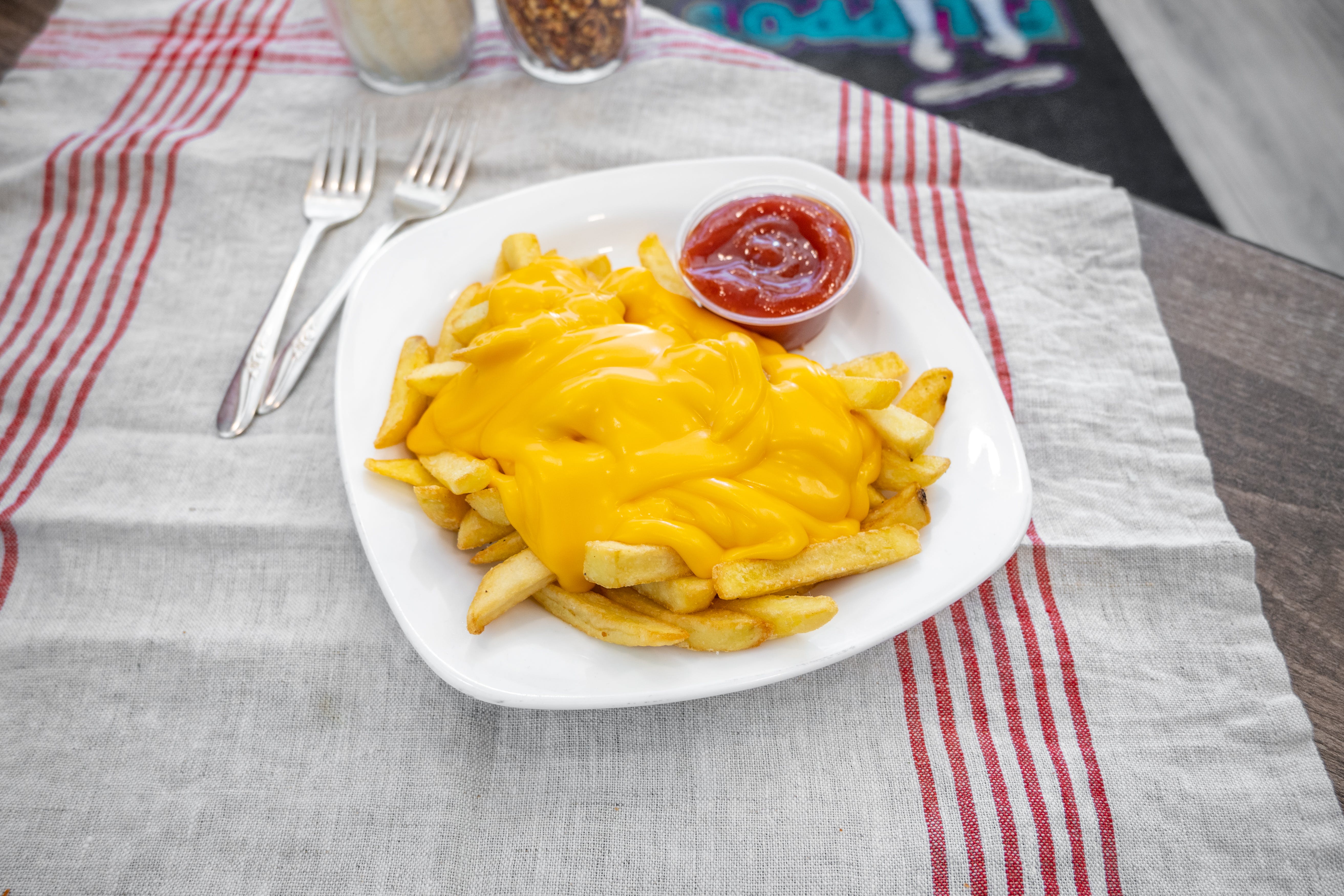 Order Cheese Fries - Appetizer food online from Filippo's Pizzeria & Grill store, Glassboro on bringmethat.com