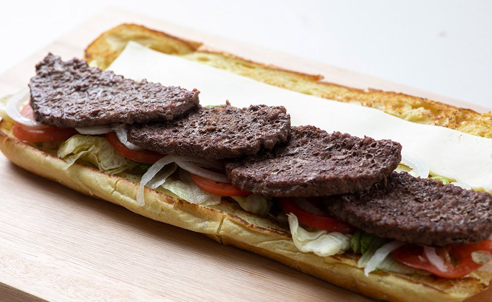Order Cheeseburger Sub - Half food online from Calz Pizza store, Norfolk on bringmethat.com