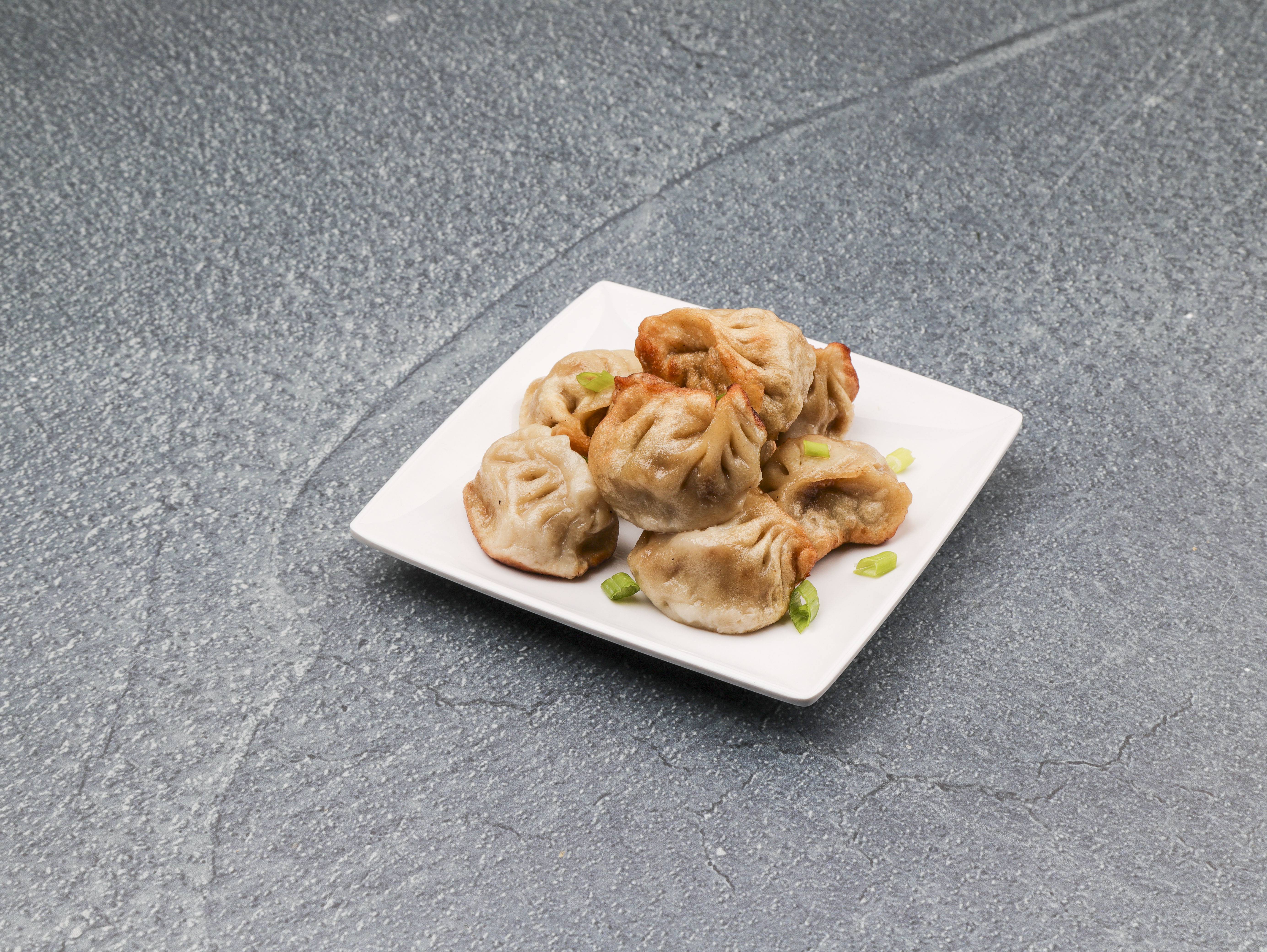 Order 9. Steamed Dumpling food online from New China store, St. Louis on bringmethat.com