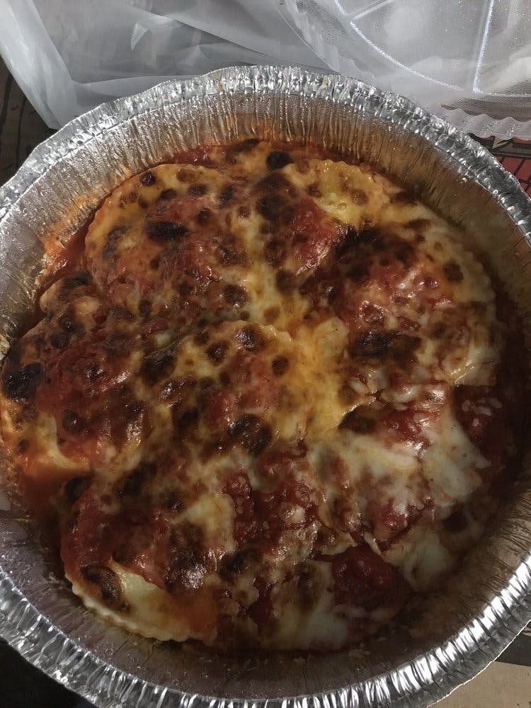 Order Baked Ravioli - Pasta food online from Red Tomato Pizzeria store, Mclean on bringmethat.com