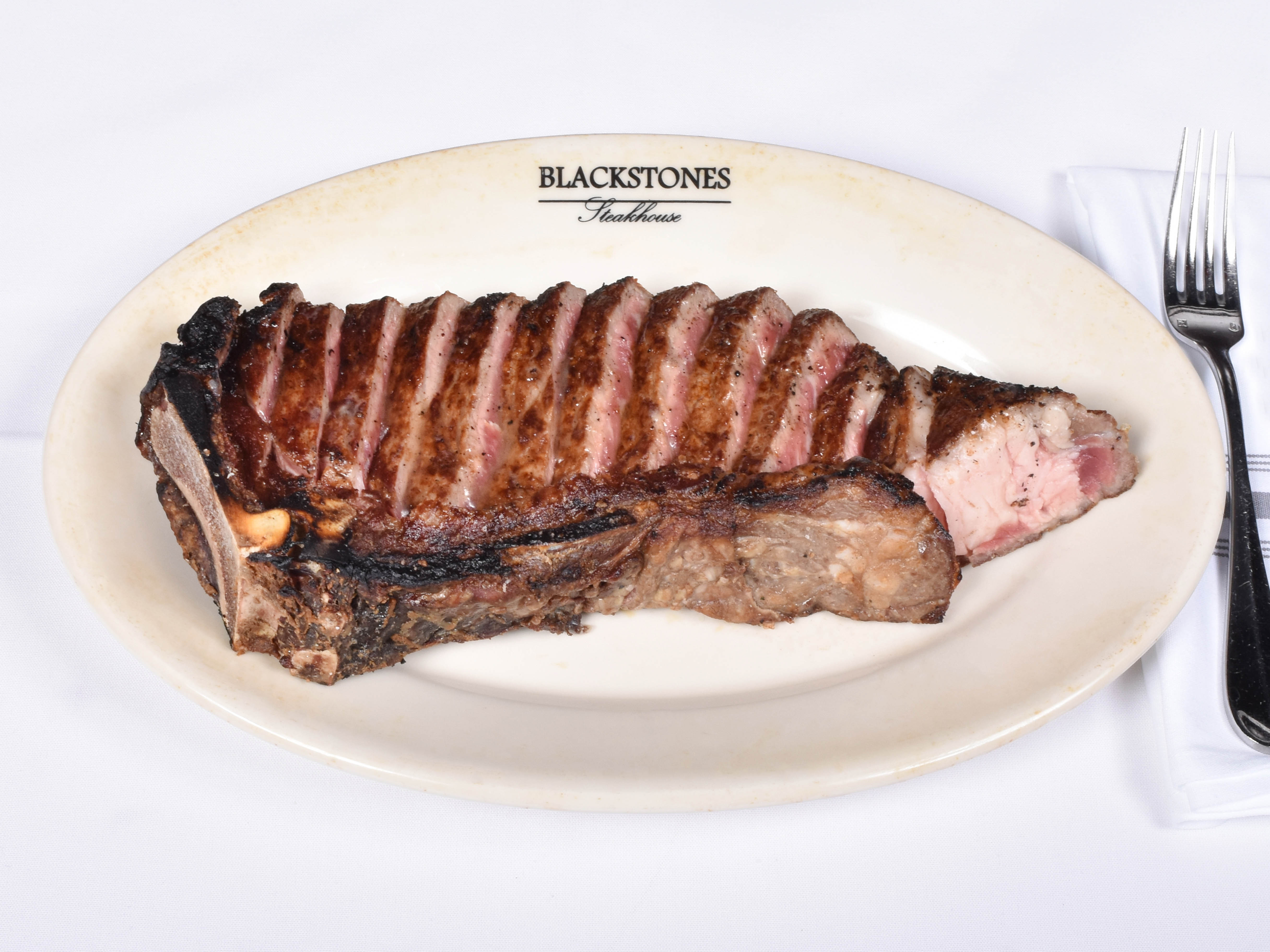 Order Bone In New York Strip food online from Blackstones Grille store, Southport on bringmethat.com
