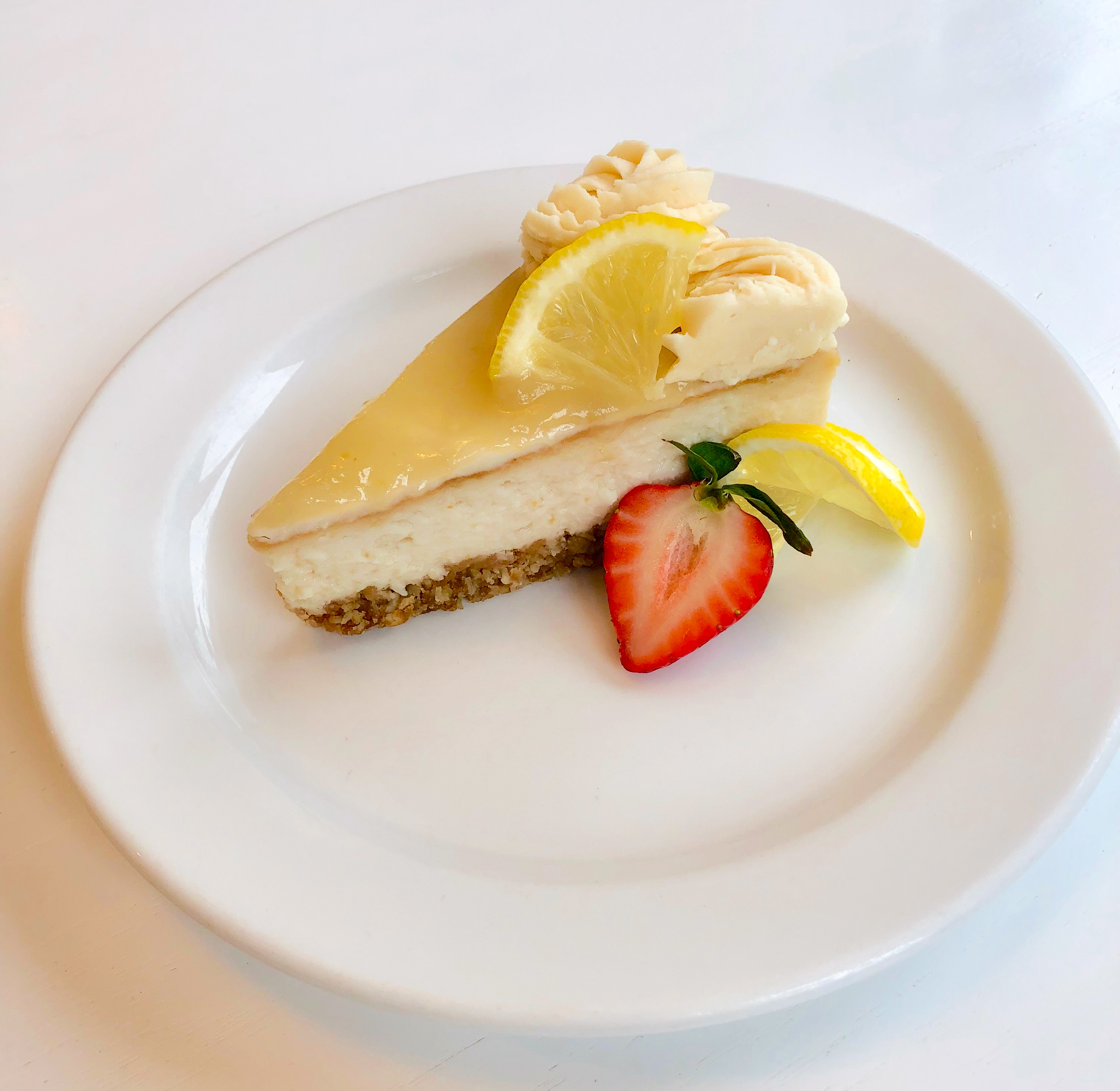 Order Slice of Lemon Cheesecake food online from Petunia Pies & Pastries store, Portland on bringmethat.com