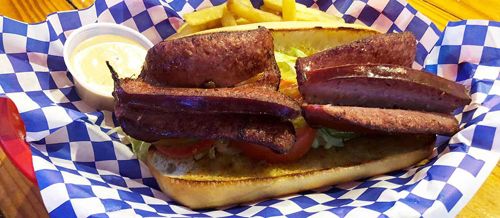 Order Smoked Sausage Po Boy Sandwich food online from Cajun Crab store, Irving on bringmethat.com