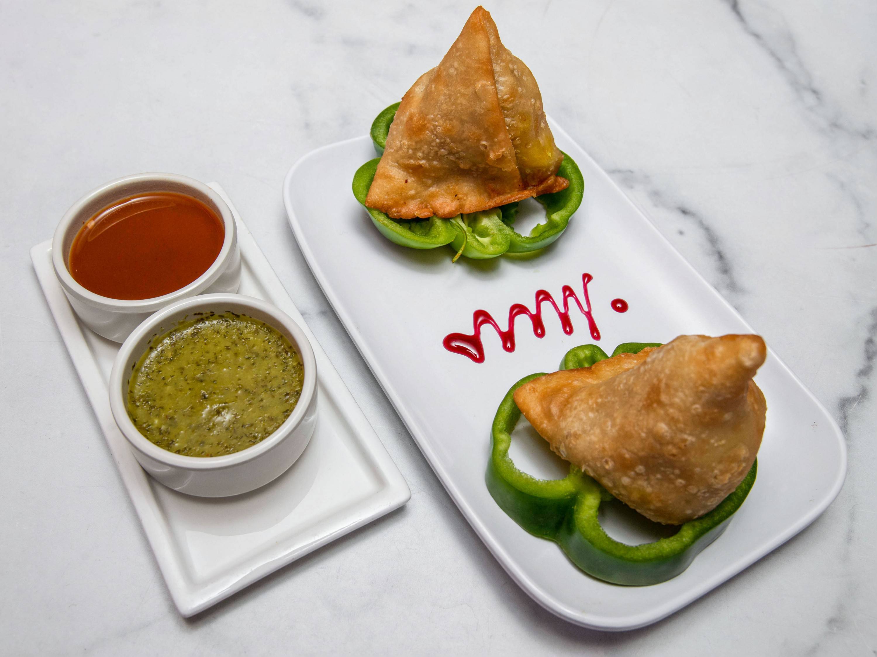 Order Vegetable Samosas served with chutneys food online from Masala store, New York on bringmethat.com