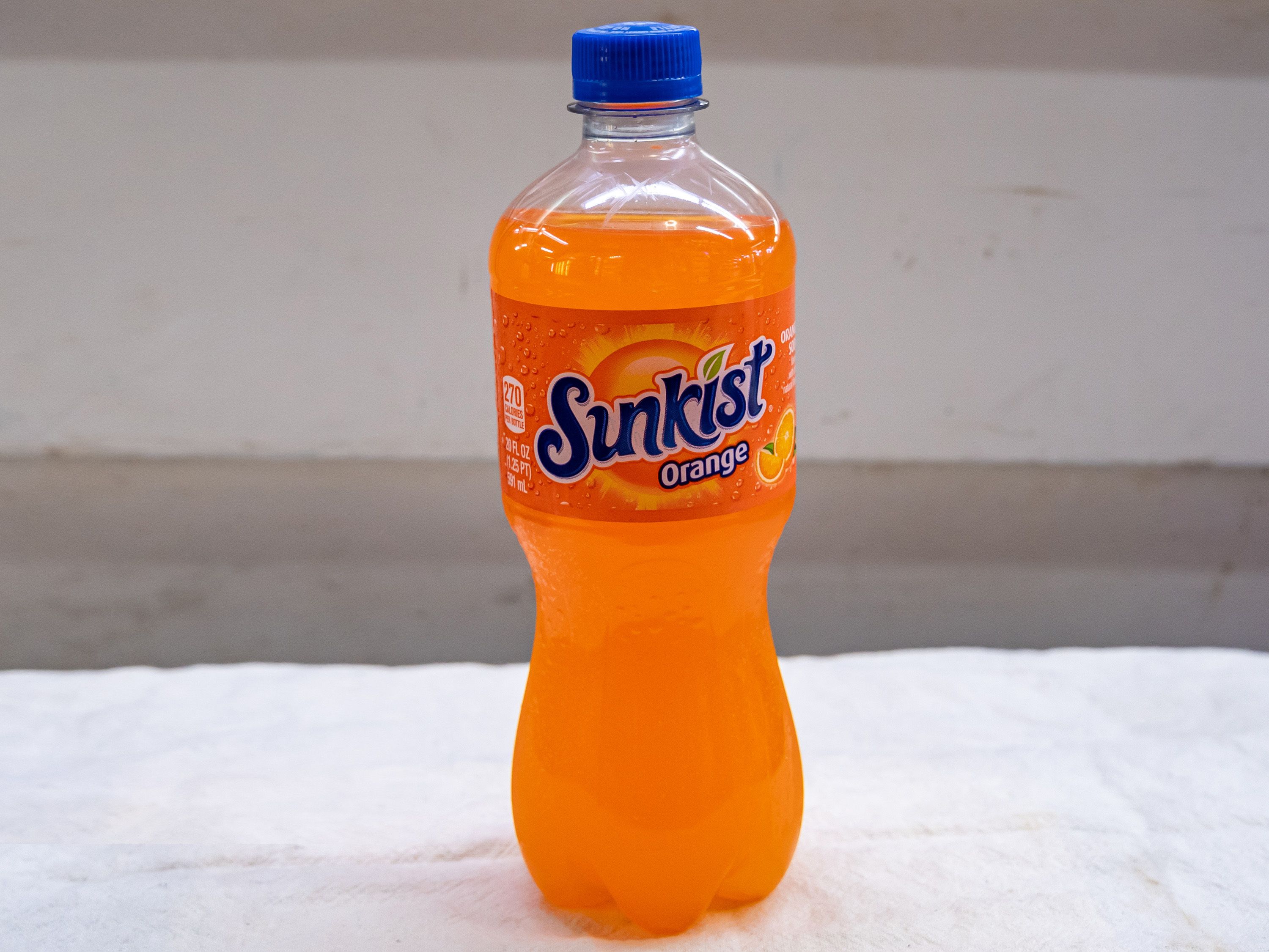 Order Sunkist Orange -20oz bottle food online from Quentin Deli and Grocery store, Brooklyn on bringmethat.com