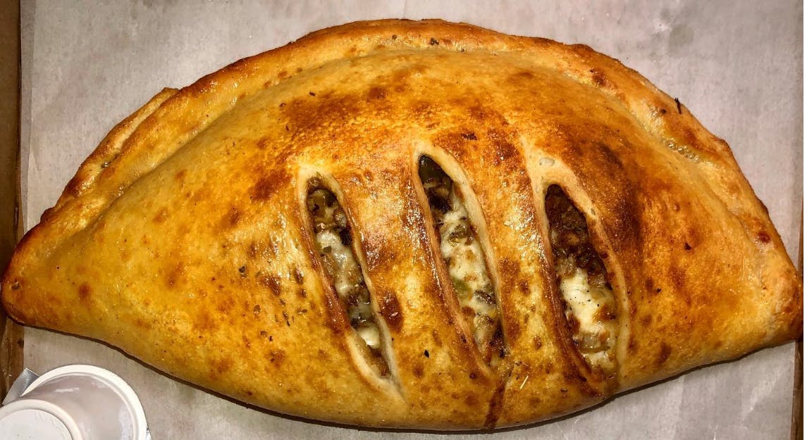 Order Chicken Steak Calzone - Calzone food online from Mikie's Pizza & Subs store, Baltimore on bringmethat.com