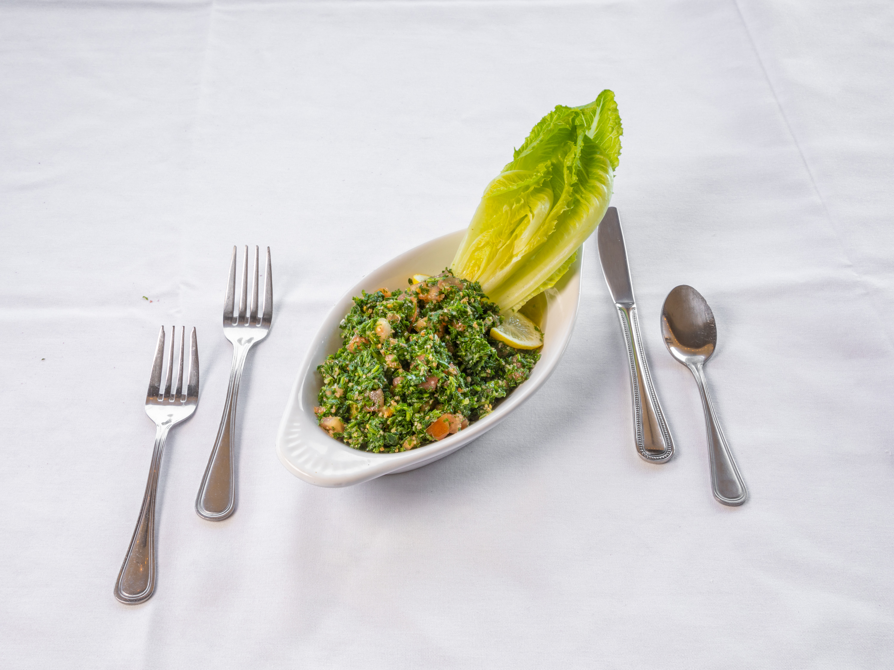 Order Tabouli Salad food online from Famous Steakhouse store, Tulsa on bringmethat.com