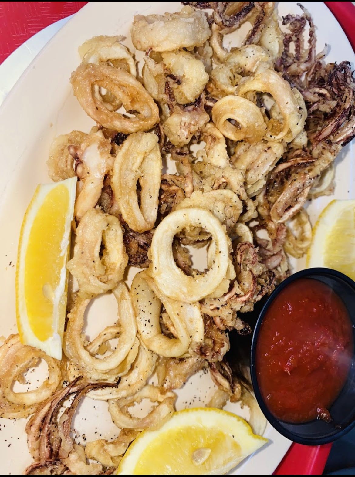 Order Fried Calamari - Sides food online from Pizza Mania store, Norcross on bringmethat.com