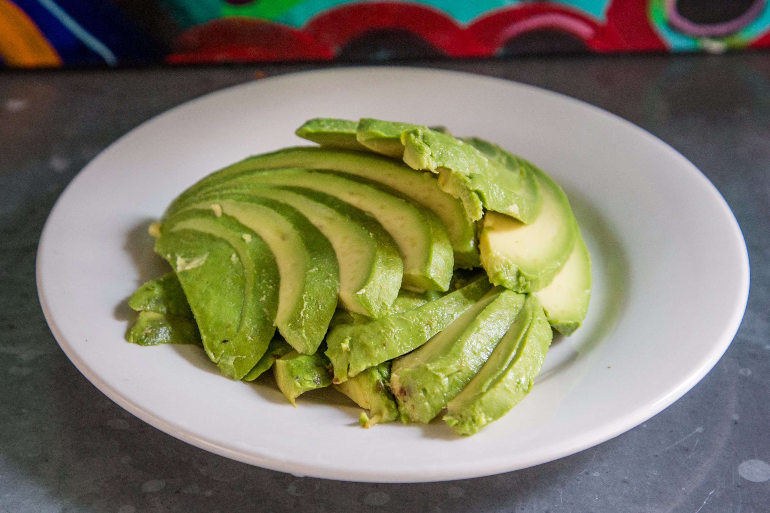 Order 75. Side of Avocado food online from Al horno lean mexican kitchen catering store, New York on bringmethat.com