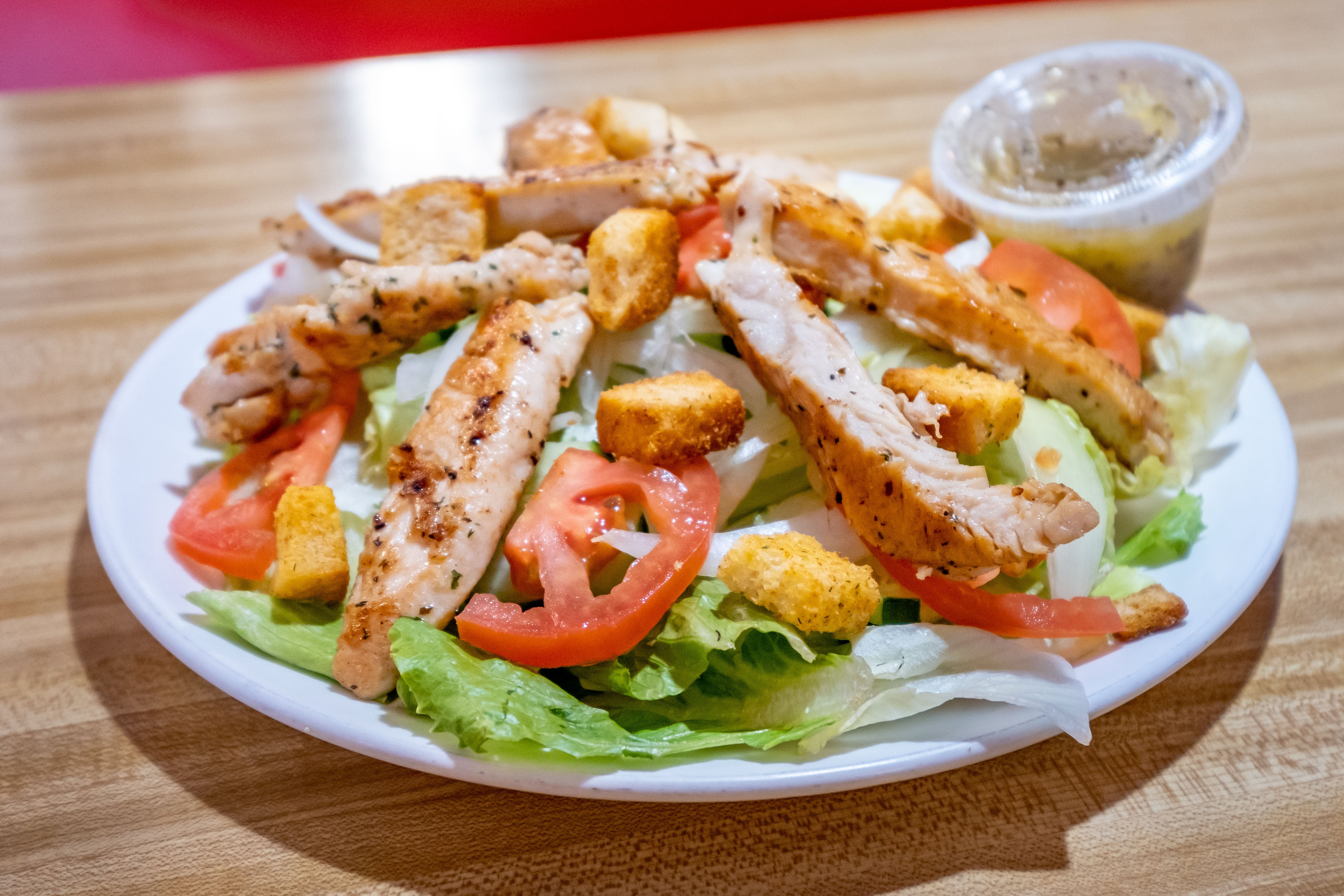 Order Caesar Salad with Chicken - Salad food online from Brother's Pizza store, Shippensburg on bringmethat.com