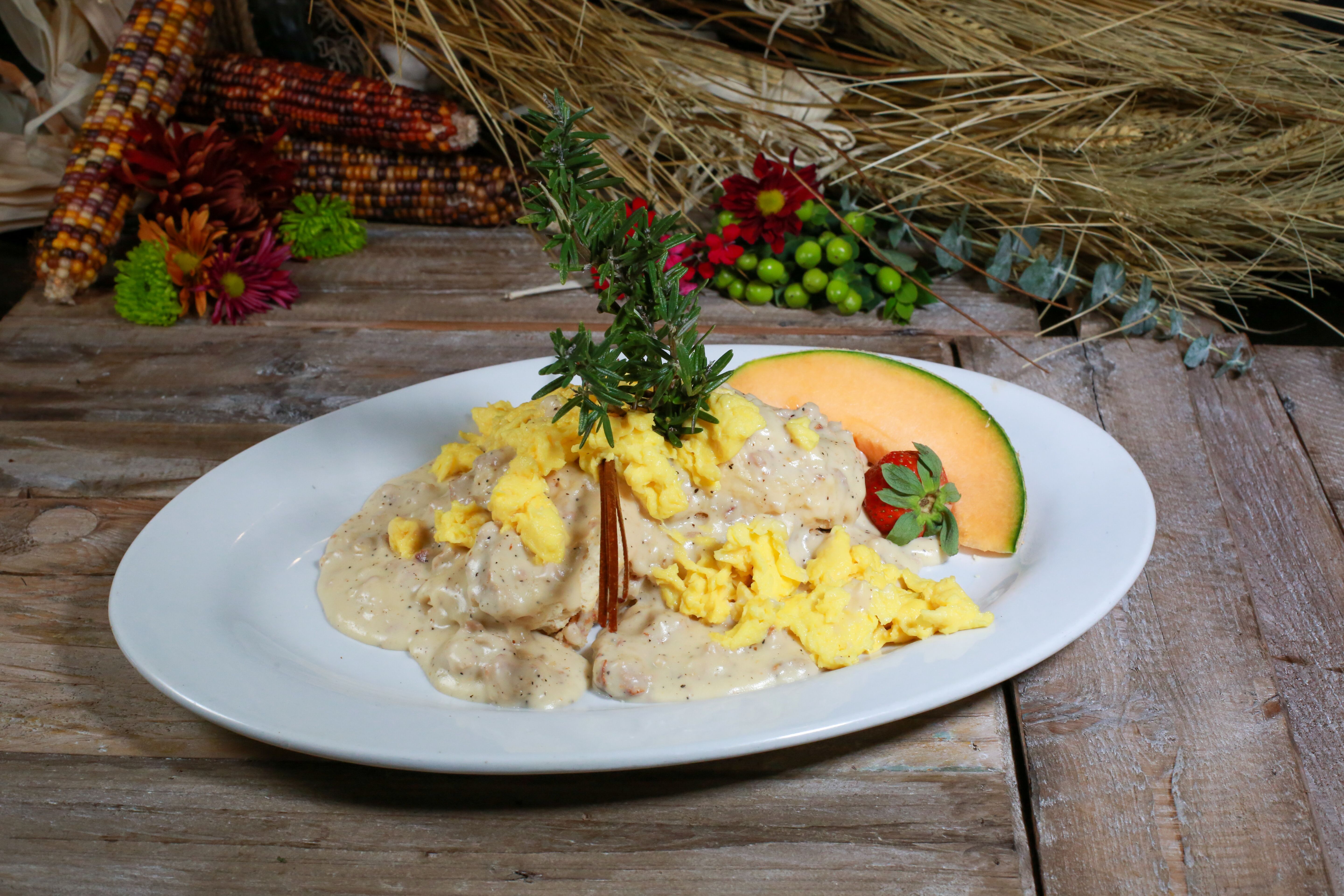 Order Biscuits & Sausage Gravy with Eggs food online from Hash House A Go Go store, Henderson on bringmethat.com