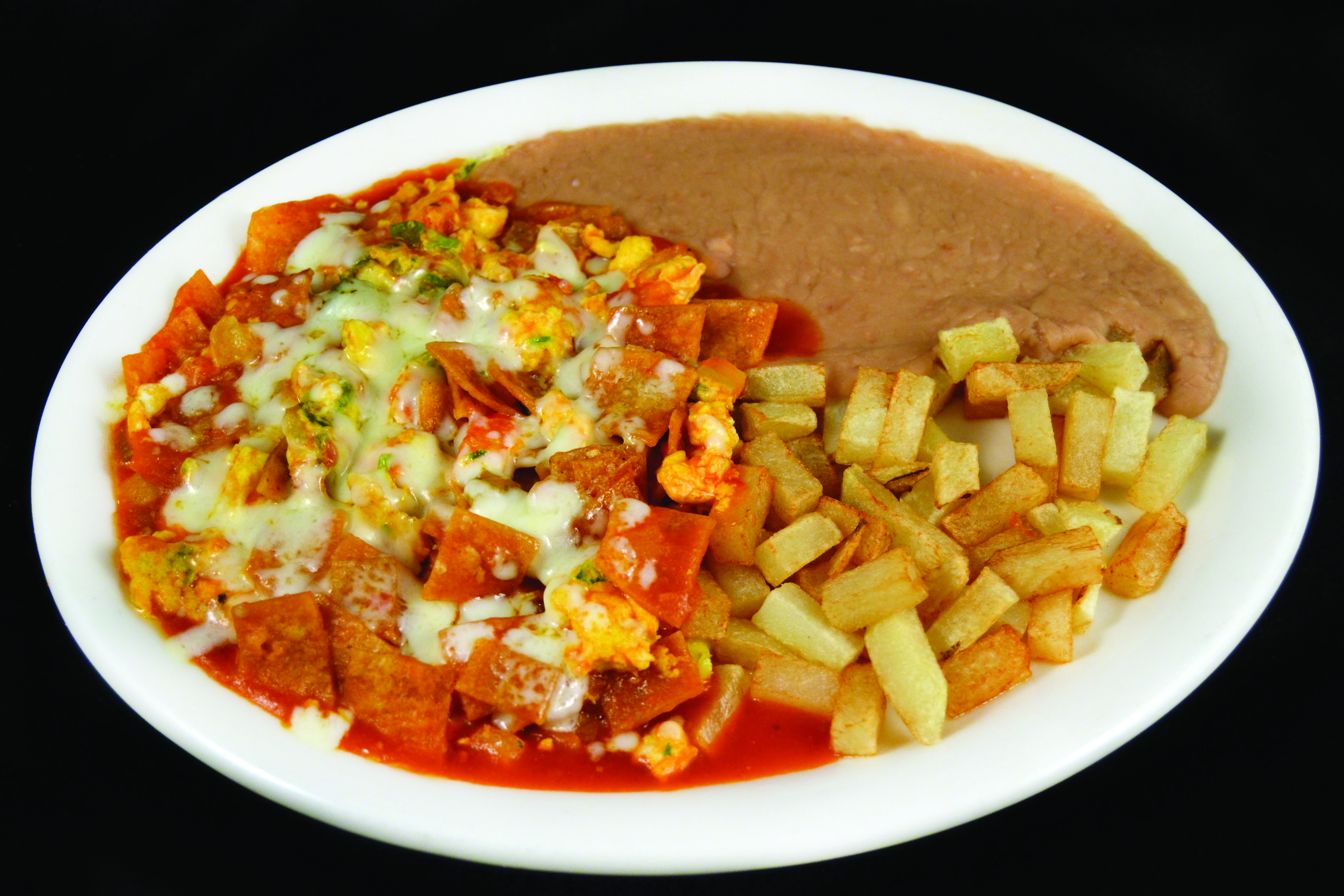 Order Chilaquiles food online from Mi Comal Mexican Restaurant store, Irving on bringmethat.com